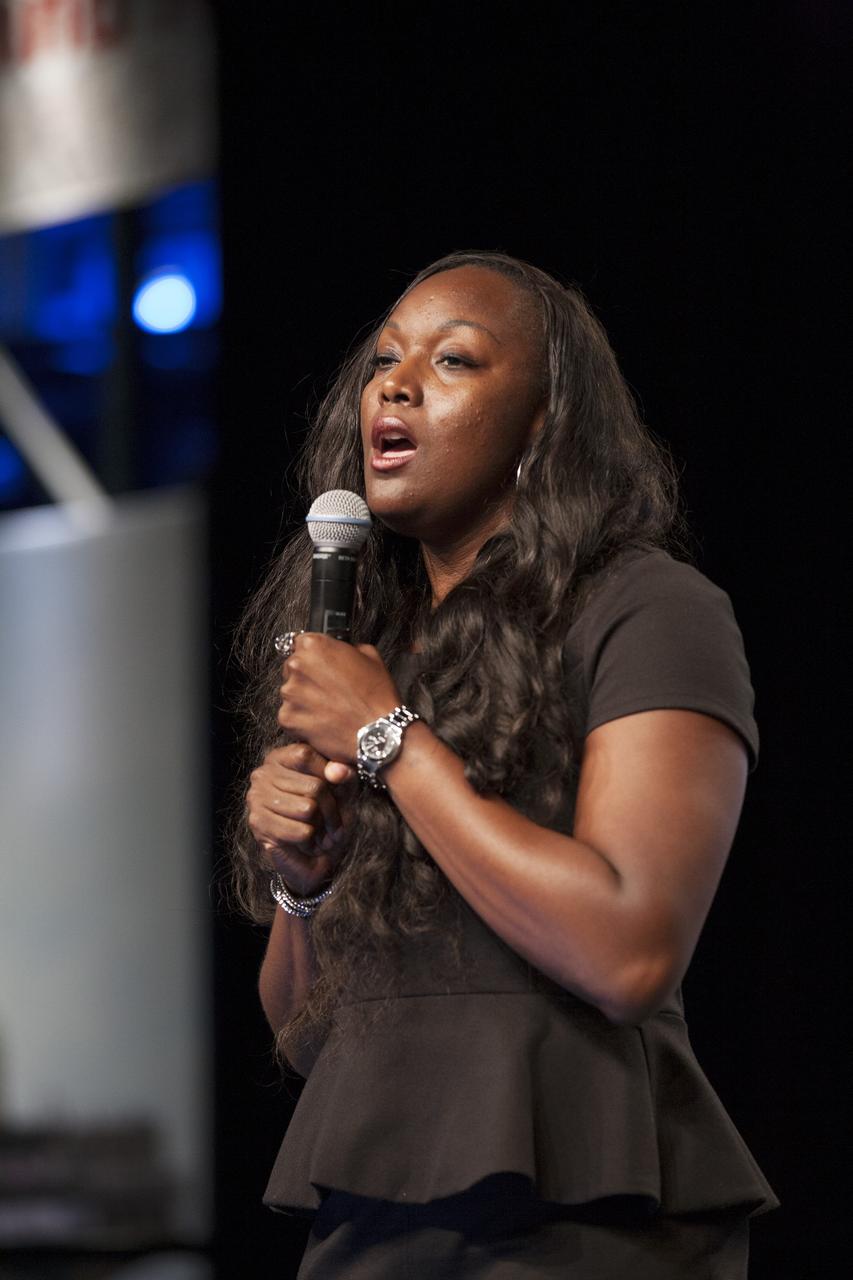 CAPE CANAVERAL, Fla. – Shamika Hamilton, in NASA's Launch Services Program, sings the National Anthem during the opening of the U.S. Astronaut Hall of Fame Induction ceremony inside the Space Shuttle Atlantis attraction at NASA’s Kennedy Space Center Visitor Complex in Florida. Space shuttle astronauts and space explorers Shannon Lucid and Jerry Ross were inducted into the Hall of Fame Class of 2014.    The 2014 inductees are selected by a committee of Hall of Fame astronauts, former NASA officials, flight directors, historians and journalists. The process is administered by the Astronaut Scholarship Foundation. To be eligible, an astronaut must have made his or her first flight at least 17 years before the induction. Candidates must be a U.S. citizen and a NASA-trained commander, pilot or mission specialist who has orbited the earth at least once. Including Lucid and Ross, 87 astronauts have been inducted into the AHOF.  Photo credit: NASA/Kim Shiflett
