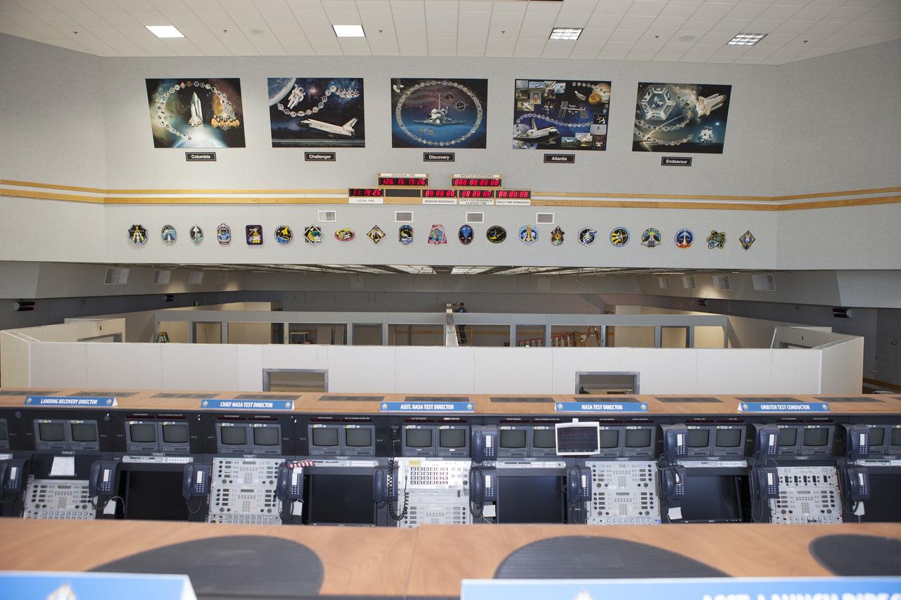CAPE CANAVERAL, Fla. – Construction workers have installed the framing and most of the inner walls inside Firing Room 4 in the Launch Control Center at NASA's Kennedy Space Center in Florida. The main floor has been divided into four separate rooms. Three rows of upper level management consoles remain. The Ground Systems Development and Operations Program is overseeing efforts to create a new firing room based on a multi-user concept.    The design of Firing Room 4 will incorporate five control room areas that are flexible to meet current and future NASA and commercial user requirements. The equipment and most of the consoles from Firing Room 4 were moved to Firing Room 2 for possible future reuse. Photo credit: NASA/Daniel Casper