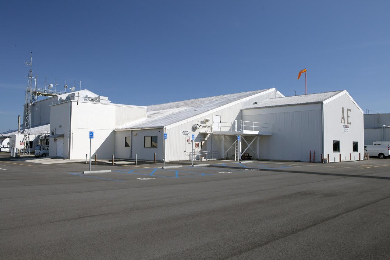 CAPE CANAVERAL, Fla. – Hangar AE on Cape Canav¬eral Air Force Station in Florida is used by NASA’s Launch Services Program as its communications center. The facility contains the program's Mission Director's Center, Launch Vehicle Data Center, and Telemetry Lab. The hangar, originally built in 1958 for a Department of De¬fense missile program, was acquired by NASA in 1960 and modified to support unmanned missions. To learn more about Hangar AE, visit http://www.nasa.gov/sites/default/files/files/Hangar-AE.pdf.  For more about Kennedy Space Center, visit http://www.nasa.gov/kennedy. Photo credit: NASA/Daniel Casper