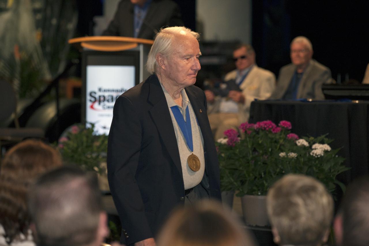 CAPE CANAVERAL, Fla. -- Inside the Space Shuttle Atlantis attraction at NASA’s Kennedy Space Center Visitor Complex in Florida, former NASA astronaut and Hall of Famer Vance Brand walks the red carpet at the 2014 U.S. Astronaut Hall of Fame Induction ceremony. Space shuttle astronauts and space explorers Shannon Lucid and Jerry Ross were inducted into the Hall of Fame Class of 2014.    The 2014 inductees are selected by a committee of Hall of Fame astronauts, former NASA officials, flight directors, historians and journalists. The process is administered by the Astronaut Scholarship Foundation. To be eligible, an astronaut must have made his or her first flight at least 17 years before the induction. Candidates must be a U.S. citizen and a NASA-trained commander, pilot or mission specialist who has orbited the earth at least once. Including Lucid and Ross, 87 astronauts have been inducted into the AHOF.  Photo credit: NASA/Kim Shiflett