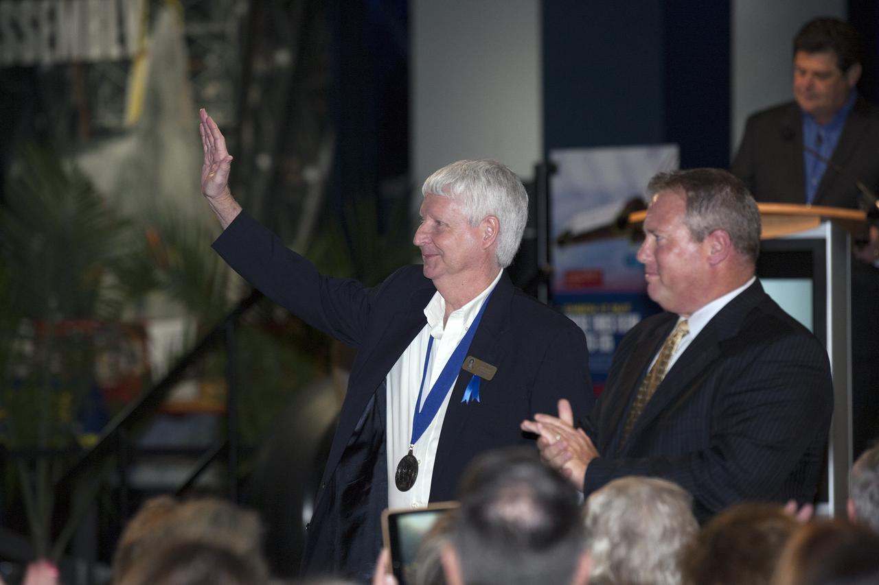 CAPE CANAVERAL, Fla. -- Inside the Space Shuttle Atlantis attraction at NASA’s Kennedy Space Center Visitor Complex in Florida, former NASA astronaut and Hall of Famer Steve Hawley walks the red carpet at the 2014 U.S. Astronaut Hall of Fame Induction ceremony. Space shuttle astronauts and space explorers Shannon Lucid and Jerry Ross were inducted into the Hall of Fame Class of 2014.    The 2014 inductees are selected by a committee of Hall of Fame astronauts, former NASA officials, flight directors, historians and journalists. The process is administered by the Astronaut Scholarship Foundation. To be eligible, an astronaut must have made his or her first flight at least 17 years before the induction. Candidates must be a U.S. citizen and a NASA-trained commander, pilot or mission specialist who has orbited the earth at least once. Including Lucid and Ross, 87 astronauts have been inducted into the AHOF.  Photo credit: NASA/Kim Shiflett
