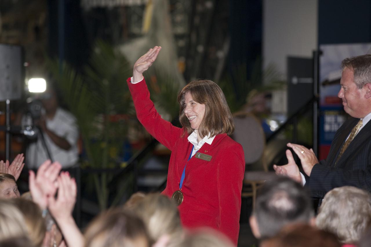 CAPE CANAVERAL, Fla. -- Inside the Space Shuttle Atlantis attraction at NASA’s Kennedy Space Center Visitor Complex in Florida, former NASA astronaut and Hall of Famer Bonnie Dunbar walks the red carpet at the 2014 U.S. Astronaut Hall of Fame Induction ceremony. Space shuttle astronauts and space explorers Shannon Lucid and Jerry Ross were inducted into the Hall of Fame Class of 2014. The 2014 inductees are selected by a committee of Hall of Fame astronauts, former NASA officials, flight directors, historians and journalists. The process is administered by the Astronaut Scholarship Foundation. To be eligible, an astronaut must have made his or her first flight at least 17 years before the induction. Candidates must be a U.S. citizen and a NASA-trained commander, pilot or mission specialist who has orbited the earth at least once. Including Lucid and Ross, 87 astronauts have been inducted into the AHOF. Photo credit: NASA/Kim Shiflett