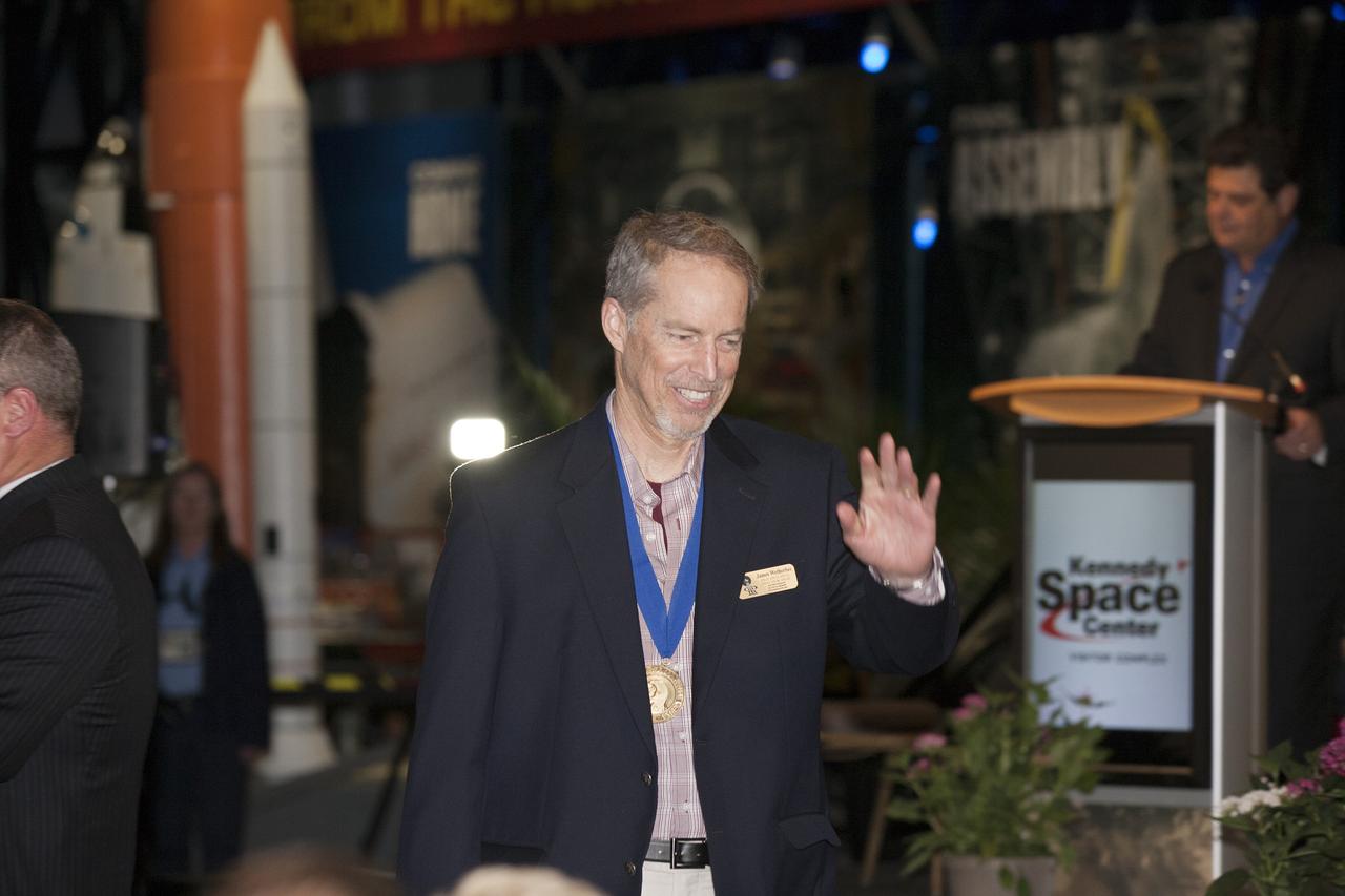 CAPE CANAVERAL, Fla. -- Inside the Space Shuttle Atlantis attraction at NASA’s Kennedy Space Center Visitor Complex in Florida, former NASA astronaut and Hall of Famer James Wetherbee walks the red carpet at the 2014 U.S. Astronaut Hall of Fame Induction ceremony. Space shuttle astronauts and space explorers Shannon Lucid and Jerry Ross were inducted into the Hall of Fame Class of 2014. The 2014 inductees are selected by a committee of Hall of Fame astronauts, former NASA officials, flight directors, historians and journalists. The process is administered by the Astronaut Scholarship Foundation. To be eligible, an astronaut must have made his or her first flight at least 17 years before the induction. Candidates must be a U.S. citizen and a NASA-trained commander, pilot or mission specialist who has orbited the earth at least once. Including Lucid and Ross, 87 astronauts have been inducted into the AHOF. Photo credit: NASA/Kim Shiflett