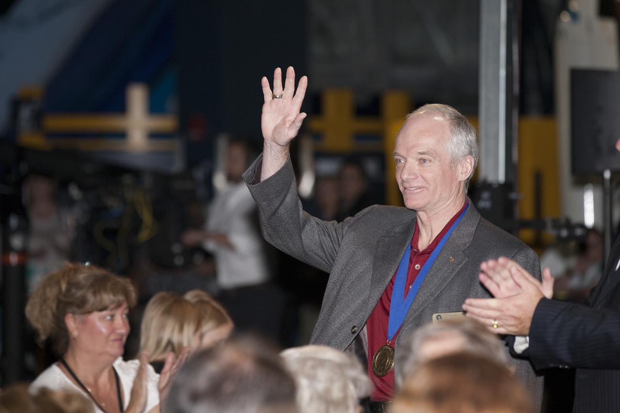 CAPE CANAVERAL, Fla. -- Inside the Space Shuttle Atlantis attraction at NASA’s Kennedy Space Center Visitor Complex in Florida, former NASA astronaut and Hall of Famer Charlie Precourt walks the red carpet at the 2014 U.S. Astronaut Hall of Fame Induction ceremony. Space shuttle astronauts and space explorers Shannon Lucid and Jerry Ross were inducted into the Hall of Fame Class of 2014. The 2014 inductees are selected by a committee of Hall of Fame astronauts, former NASA officials, flight directors, historians and journalists. The process is administered by the Astronaut Scholarship Foundation. To be eligible, an astronaut must have made his or her first flight at least 17 years before the induction. Candidates must be a U.S. citizen and a NASA-trained commander, pilot or mission specialist who has orbited the earth at least once. Including Lucid and Ross, 87 astronauts have been inducted into the AHOF. Photo credit: NASA/Kim Shiflett