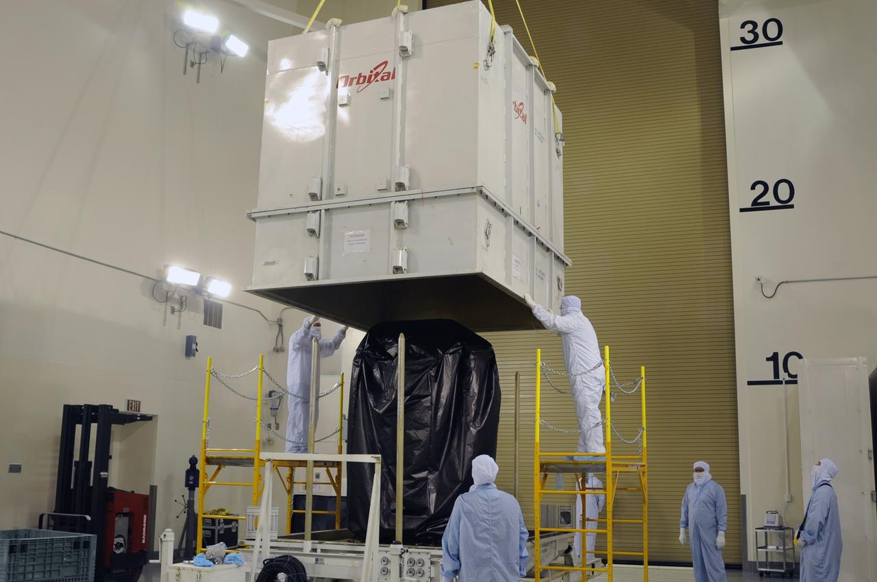 VANDENBERG AIR FORCE BASE, Calif. – In the Astrotech payload processing facility on Vandenberg Air Force Base in California, the lid is lifted from the transportation trailer, revealing NASA's Orbiting Carbon Observatory-2, or OCO-2, wrapped for protection during its delivery. Testing and launch preparations now will get underway for its launch from Space Launch Complex 2 aboard a United Launch Alliance Delta II rocket, scheduled for July 1, 2014. The observatory will collect precise global measurements of carbon dioxide in the Earth's atmosphere and provide scientists with a better idea of the chemical compound's impacts on climate change. Scientists will analyze this data to improve our understanding of the natural processes and human activities that regulate the abundance and distribution of this important atmospheric gas. OCO-2 is a NASA Earth System Science Pathfinder Program mission managed by NASA's Jet Propulsion Laboratory JPL in Pasadena, California, for NASA's Science Mission Directorate in Washington. Orbital Sciences built the spacecraft and provides mission operations under JPL’s leadership. To learn more about OCO-2, visit http://oco.jpl.nasa.gov. Photo credit: NASA/Doug Gruben, 30th Space Wing