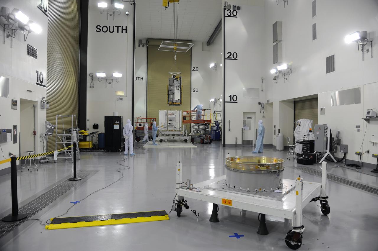 VANDENBERG AIR FORCE BASE, Calif. – In the Astrotech payload processing facility on Vandenberg Air Force Base in California, NASA's Orbiting Carbon Observatory-2, or OCO-2, is lifted from its transportation trailer for its move onto the test fixture in the foreground. Testing and launch preparations now will get underway for its launch from Space Launch Complex 2 aboard a United Launch Alliance Delta II rocket, scheduled for July 1, 2014. The observatory will collect precise global measurements of carbon dioxide in the Earth's atmosphere and provide scientists with a better idea of the chemical compound's impacts on climate change. Scientists will analyze this data to improve our understanding of the natural processes and human activities that regulate the abundance and distribution of this important atmospheric gas. OCO-2 is a NASA Earth System Science Pathfinder Program mission managed by NASA's Jet Propulsion Laboratory JPL in Pasadena, California, for NASA's Science Mission Directorate in Washington. Orbital Sciences built the spacecraft and provides mission operations under JPL’s leadership. To learn more about OCO-2, visit http://oco.jpl.nasa.gov. Photo credit: NASA/Doug Gruben, 30th Space Wing