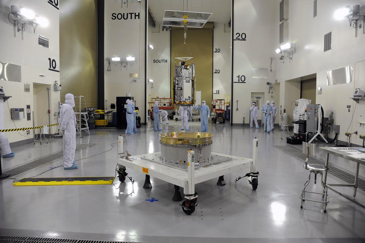 VANDENBERG AIR FORCE BASE, Calif. – In the Astrotech payload processing facility on Vandenberg Air Force Base in California, Orbital Sciences workers and technicians monitor NASA's Orbiting Carbon Observatory-2, or OCO-2, as it glides across the room from its transportation trailer toward a test fixture. Testing and launch preparations now will get underway for its launch from Space Launch Complex 2 aboard a United Launch Alliance Delta II rocket, scheduled for July 1, 2014. The observatory will collect precise global measurements of carbon dioxide in the Earth's atmosphere and provide scientists with a better idea of the chemical compound's impacts on climate change. Scientists will analyze this data to improve our understanding of the natural processes and human activities that regulate the abundance and distribution of this important atmospheric gas. OCO-2 is a NASA Earth System Science Pathfinder Program mission managed by NASA's Jet Propulsion Laboratory JPL in Pasadena, California, for NASA's Science Mission Directorate in Washington. Orbital Sciences built the spacecraft and provides mission operations under JPL’s leadership. To learn more about OCO-2, visit http://oco.jpl.nasa.gov. Photo credit: NASA/Doug Gruben, 30th Space Wing