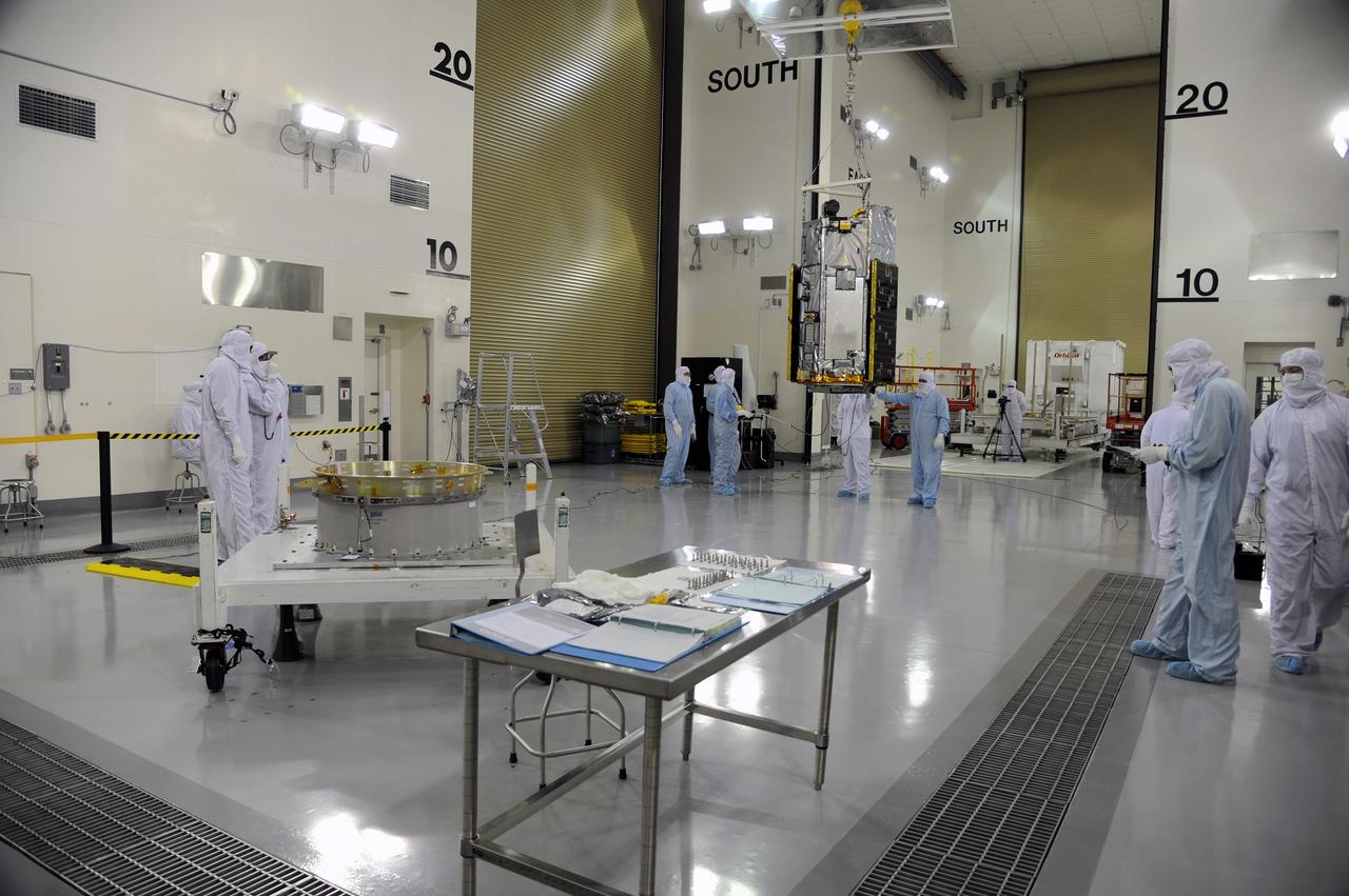 VANDENBERG AIR FORCE BASE, Calif. – In the Astrotech payload processing facility on Vandenberg Air Force Base in California, Orbital Sciences workers and technicians steady NASA's Orbiting Carbon Observatory-2, or OCO-2, as it glides across the room from its transportation trailer toward a test fixture. Testing and launch preparations now will get underway for its launch from Space Launch Complex 2 aboard a United Launch Alliance Delta II rocket, scheduled for July 1, 2014. The observatory will collect precise global measurements of carbon dioxide in the Earth's atmosphere and provide scientists with a better idea of the chemical compound's impacts on climate change. Scientists will analyze this data to improve our understanding of the natural processes and human activities that regulate the abundance and distribution of this important atmospheric gas. OCO-2 is a NASA Earth System Science Pathfinder Program mission managed by NASA's Jet Propulsion Laboratory JPL in Pasadena, California, for NASA's Science Mission Directorate in Washington. Orbital Sciences built the spacecraft and provides mission operations under JPL’s leadership. To learn more about OCO-2, visit http://oco.jpl.nasa.gov. Photo credit: NASA/Doug Gruben, 30th Space Wing