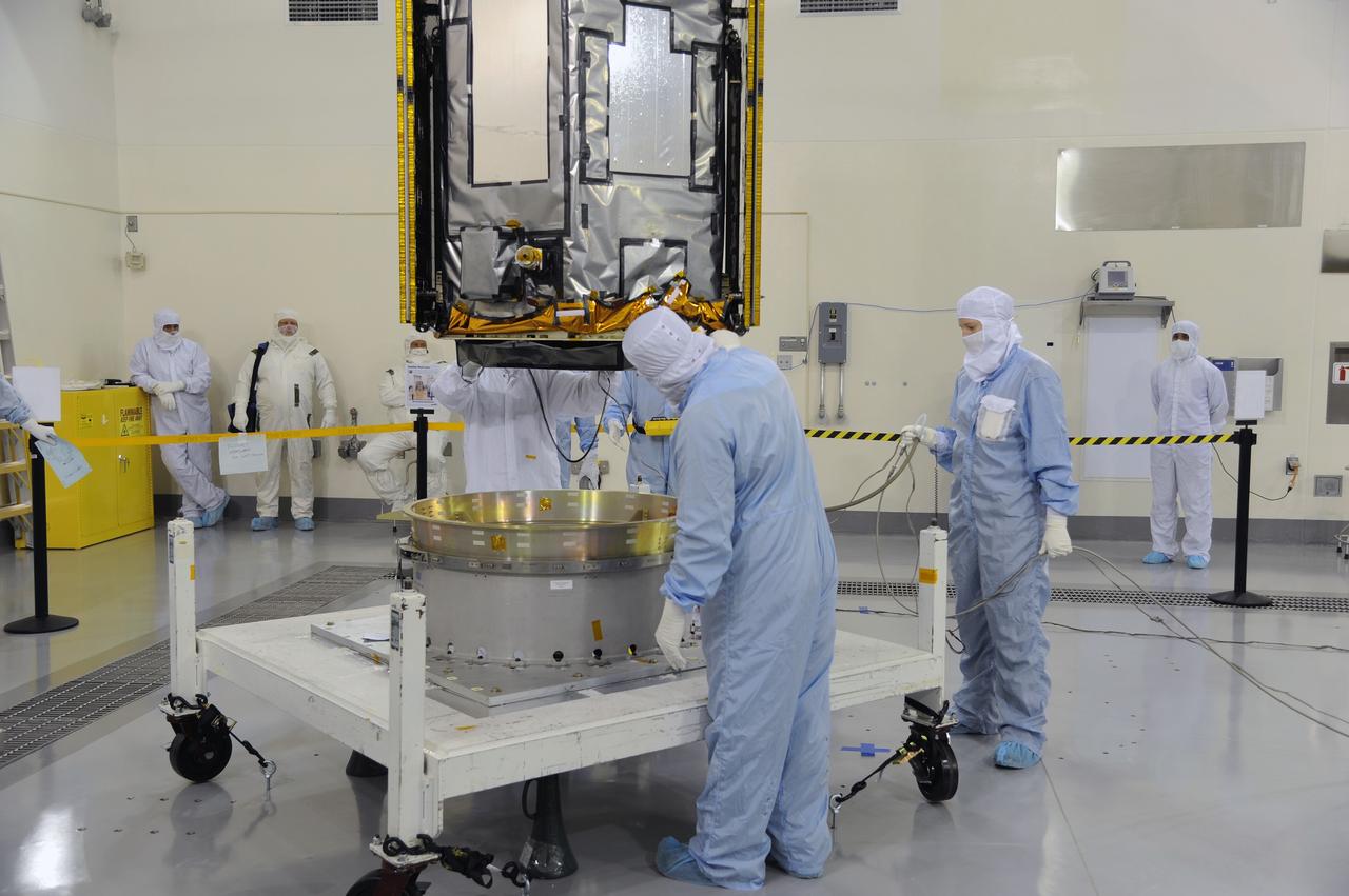 VANDENBERG AIR FORCE BASE, Calif. – In the Astrotech payload processing facility on Vandenberg Air Force Base in California, NASA's Orbiting Carbon Observatory-2, or OCO-2, is lowered onto a test fixture. Testing and launch preparations now will get underway for its launch from Space Launch Complex 2 aboard a United Launch Alliance Delta II rocket, scheduled for July 1, 2014. The observatory will collect precise global measurements of carbon dioxide in the Earth's atmosphere and provide scientists with a better idea of the chemical compound's impacts on climate change. Scientists will analyze this data to improve our understanding of the natural processes and human activities that regulate the abundance and distribution of this important atmospheric gas. OCO-2 is a NASA Earth System Science Pathfinder Program mission managed by NASA's Jet Propulsion Laboratory JPL in Pasadena, California, for NASA's Science Mission Directorate in Washington. Orbital Sciences built the spacecraft and provides mission operations under JPL’s leadership. To learn more about OCO-2, visit http://oco.jpl.nasa.gov. Photo credit: NASA/Doug Gruben, 30th Space Wing