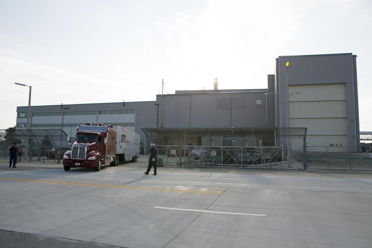 CAPE CANAVERAL, Fla. – A truck carrying NASA's International Space Station-RapidScat scatterometer instrument arrives outside the Space Station Processing Facility at Kennedy Space Center in Florida. ISS-RapidScat is the first scientific Earth-observing instrument designed to operate from the exterior of the space station. It will measure Earth's ocean surface wind speed and direction, providing data to be used in weather and marine forecasting. Built at NASA's Jet Propulsion Laboratory, ISS-RapidScat is slated to fly on the SpaceX-4 commercial cargo resupply flight in 2014. For more information, visit http://www.jpl.nasa.gov/missions/iss-rapidscat. Photo credit: NASA/Dimitri Gerondidakis