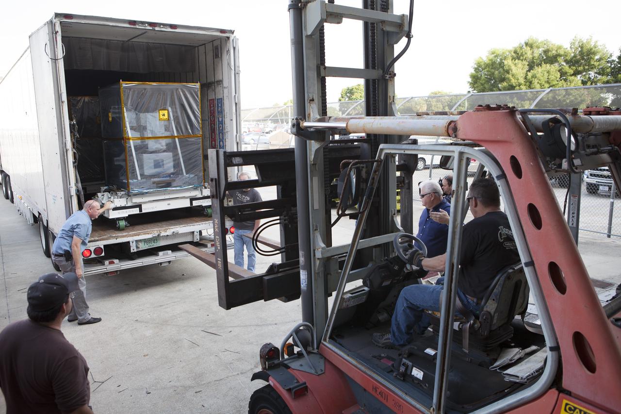 CAPE CANAVERAL, Fla. – NASA's International Space Station-RapidScat scatterometer instrument waits to be removed from the truck that delivered it to the Space Station Processing Facility at Kennedy Space Center in Florida. ISS-RapidScat is the first scientific Earth-observing instrument designed to operate from the exterior of the space station. It will measure Earth's ocean surface wind speed and direction, providing data to be used in weather and marine forecasting. Built at NASA's Jet Propulsion Laboratory, ISS-RapidScat is slated to fly on the SpaceX-4 commercial cargo resupply flight in 2014. For more information, visit http://www.jpl.nasa.gov/missions/iss-rapidscat. Photo credit: NASA/Dimitri Gerondidakis