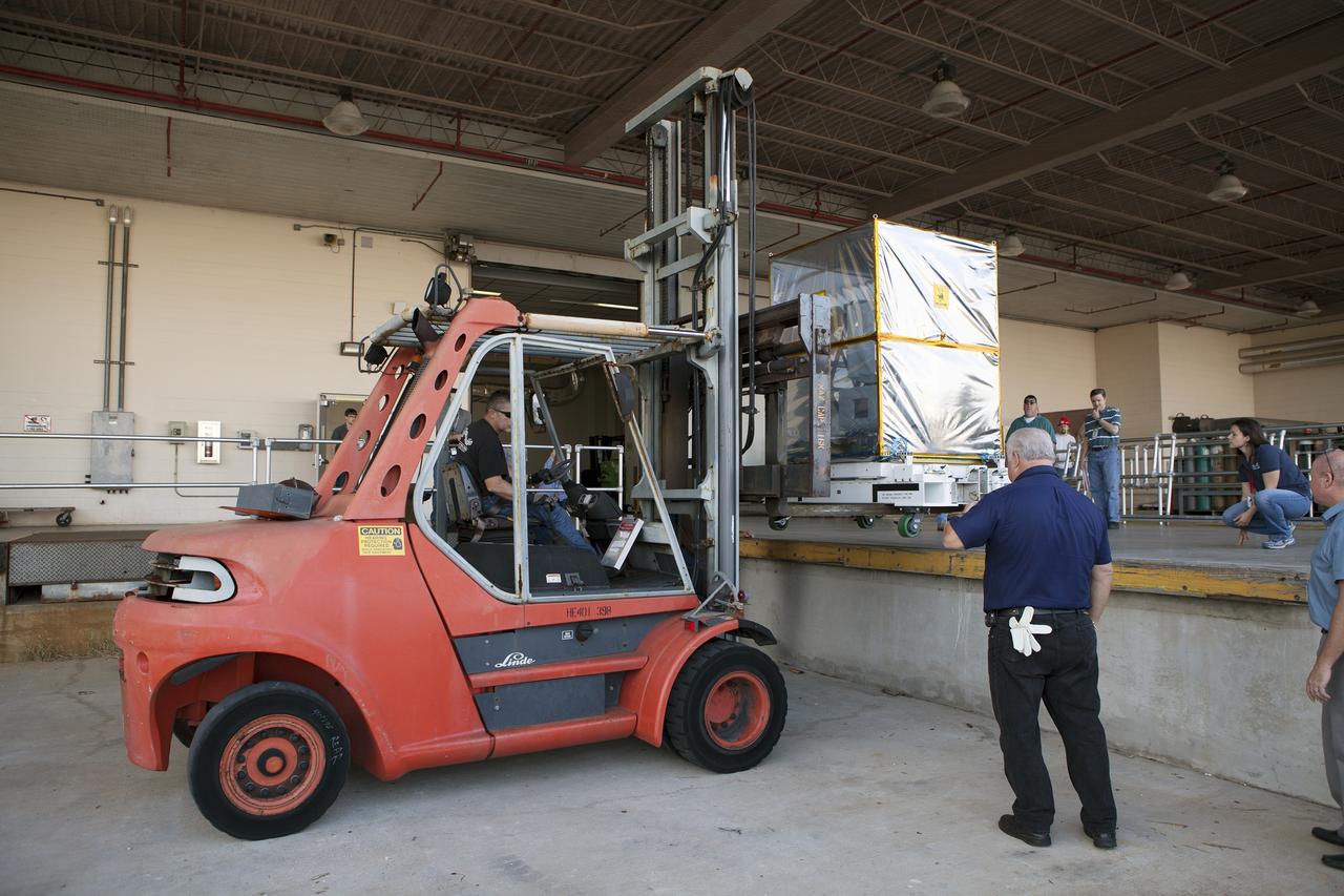 CAPE CANAVERAL, Fla. – A component of NASA's International Space Station-RapidScat scatterometer instrument is moved via forklift into the Space Station Processing Facility at Kennedy Space Center in Florida. ISS-RapidScat is the first scientific Earth-observing instrument designed to operate from the exterior of the space station. It will measure Earth's ocean surface wind speed and direction, providing data to be used in weather and marine forecasting. Built at NASA's Jet Propulsion Laboratory, ISS-RapidScat is slated to fly on the SpaceX-4 commercial cargo resupply flight in 2014. For more information, visit http://www.jpl.nasa.gov/missions/iss-rapidscat. Photo credit: NASA/Dimitri Gerondidakis