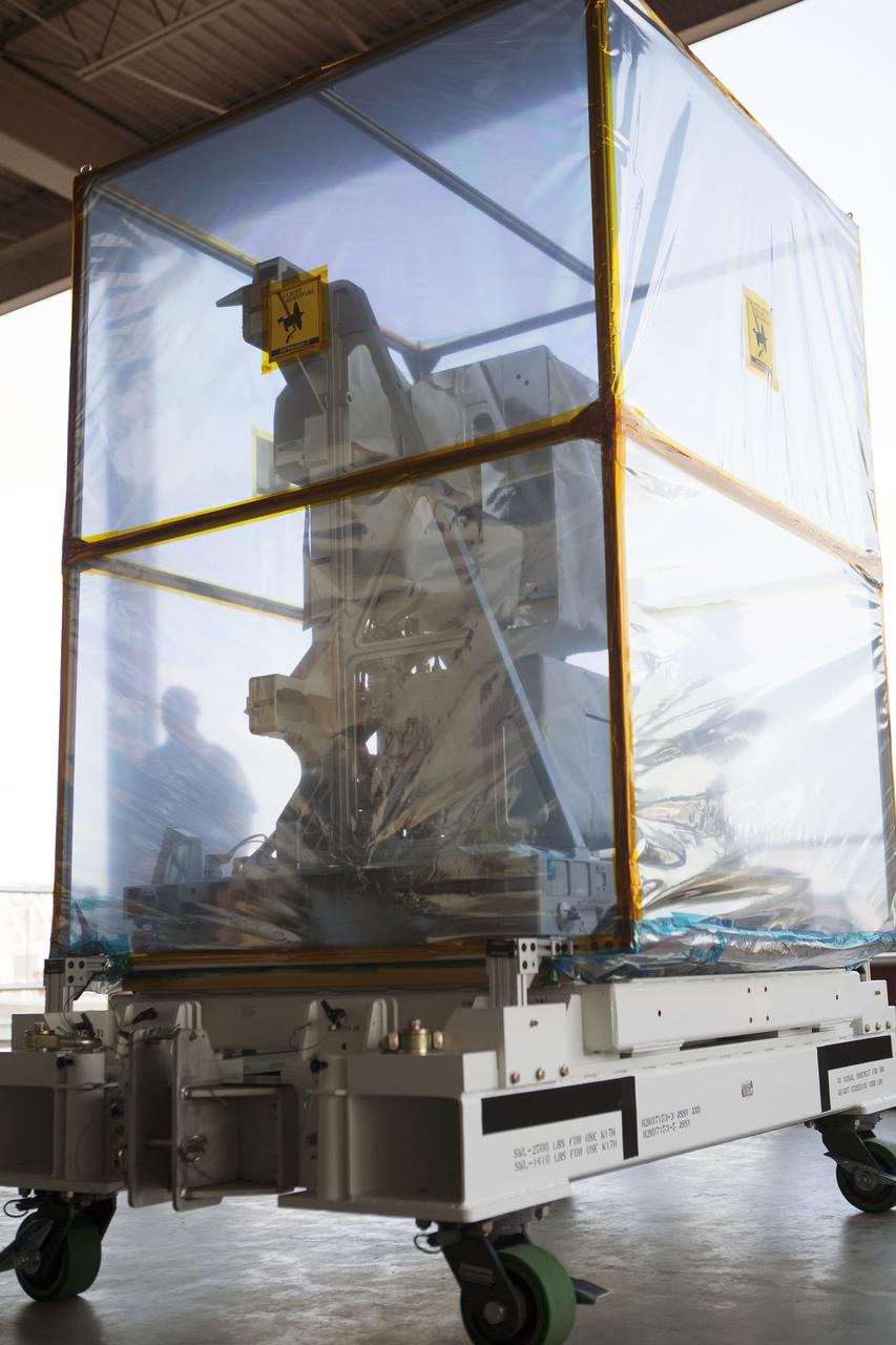 CAPE CANAVERAL, Fla. – A component of NASA's International Space Station-RapidScat scatterometer instrument is moved via forklift into the Space Station Processing Facility at Kennedy Space Center in Florida. ISS-RapidScat is the first scientific Earth-observing instrument designed to operate from the exterior of the space station. It will measure Earth's ocean surface wind speed and direction, providing data to be used in weather and marine forecasting. Built at NASA's Jet Propulsion Laboratory, ISS-RapidScat is slated to fly on the SpaceX-4 commercial cargo resupply flight in 2014. For more information, visit http://www.jpl.nasa.gov/missions/iss-rapidscat. Photo credit: NASA/Dimitri Gerondidakis