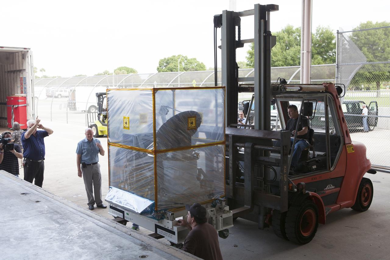 CAPE CANAVERAL, Fla. – A component of NASA's International Space Station-RapidScat scatterometer instrument is removed from a truck at the Space Station Processing Facility at Kennedy Space Center in Florida. ISS-RapidScat is the first scientific Earth-observing instrument designed to operate from the exterior of the space station. It will measure Earth's ocean surface wind speed and direction, providing data to be used in weather and marine forecasting. Built at NASA's Jet Propulsion Laboratory, ISS-RapidScat is slated to fly on the SpaceX-4 commercial cargo resupply flight in 2014. For more information, visit http://www.jpl.nasa.gov/missions/iss-rapidscat. Photo credit: NASA/Dimitri Gerondidakis