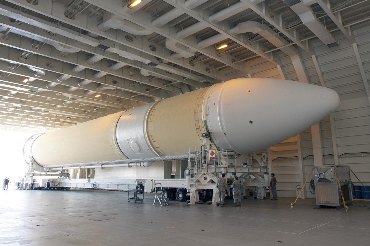 CAPE CANAVERAL, Fla. -- The port booster for the United Launch Alliance Delta IV Heavy for Exploration Flight Test-1, or EFT-1, is being offloaded from the barge at the U.S. Army Outpost wharf at Port Canaveral in Florida and will be transported to the Horizontal Integration Facility, or HIF, at Space Launch Complex 37 on Cape Canaveral Air Force Station. The upper stage and spacecraft adapter arrived with the booster and were transported to the HIF on May 6.    At the HIF, all three booster stages will be processed and checked out before being moved to the nearby launch pad and hoisted into position. The spacecraft adapter will connect Orion to the ULA Delta IV, and also will connect Orion to NASA's new rocket, the Space Launch System, on its first mission in 2017. During the EFT-1 mission, Orion will travel farther into space than any human spacecraft has gone in more than 40 years. The data gathered during the flight will influence design decisions, validate existing computer models and innovative new approaches to space systems development, as well as reduce overall mission risks and costs for later Orion flights. Liftoff of Orion on EFT-1 is planned for fall 2014. Photo credit: NASA/Kim Shiflett