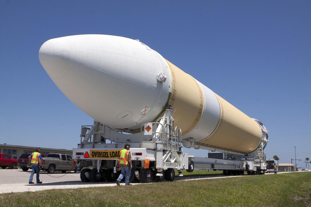 CAPE CANAVERAL, Fla. -- The port booster for the United Launch Alliance Delta IV Heavy for Exploration Flight Test-1, or EFT-1, has been offloaded from the barge at the U.S. Army Outpost wharf at Port Canaveral in Florida and is being transported to the Horizontal Integration Facility, or HIF, at Space Launch Complex 37 on Cape Canaveral Air Force Station. The upper stage and spacecraft adapter arrived with the booster and were transported to the HIF on May 6.    At the HIF, all three booster stages will be processed and checked out before being moved to the nearby launch pad and hoisted into position. The spacecraft adapter will connect Orion to the ULA Delta IV, and also will connect Orion to NASA's new rocket, the Space Launch System, on its first mission in 2017. During the EFT-1 mission, Orion will travel farther into space than any human spacecraft has gone in more than 40 years. The data gathered during the flight will influence design decisions, validate existing computer models and innovative new approaches to space systems development, as well as reduce overall mission risks and costs for later Orion flights. Liftoff of Orion on EFT-1 is planned for fall 2014. Photo credit: NASA/Kim Shiflett