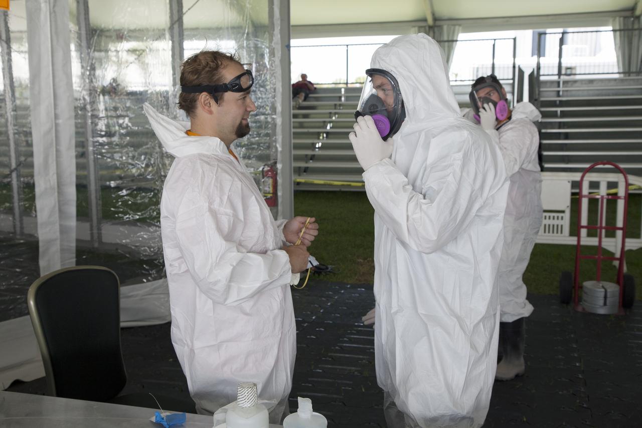 CAPE CANAVERAL, Fla. – College students prepare for a trial run in the robot pit at NASA’s Robotics Mining Competition at the Kennedy Space Center Visitor Complex in Florida. More than 35 teams from around the U.S. have designed and built remote-controlled robots for the mining competition. The competition is a NASA Human Exploration and Operations Mission Directorate project designed to engage and retain students in science, technology, engineering and mathematics, or STEM, fields by expanding opportunities for student research and design. Teams use their remote-controlled robotics to maneuver and dig in a supersized sandbox filled with a crushed material that has characteristics similar to Martian soil. The objective of the challenge is to see which team’s robot can collect and move the most regolith within a specified amount of time. For more information, visit www.nasa.gov/nasarmc. Photo credit: NASA/Ben Smegelsky