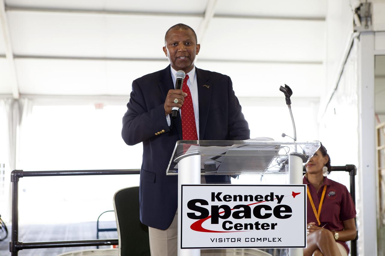 CAPE CANAVERAL, Fla. – Kelvin Manning, associate director of Kennedy Space Center, speaks to the college and university teams during the opening ceremony of NASA’s 2014 Robotics Mining Competition at the Kennedy Space Center Visitor Complex in Florida. More than 35 teams from around the U.S. have designed and built remote-controlled robots for the mining competition.     The competition is a NASA Human Exploration and Operations Mission Directorate project designed to engage and retain students in science, technology, engineering and mathematics, or STEM, fields by expanding opportunities for student research and design. Teams use their remote-controlled robotics to maneuver and dig in a supersized sandbox filled with a crushed material that has characteristics similar to Martian soil. The objective of the challenge is to see which team’s robot can collect and move the most regolith within a specified amount of time. For more information, visit www.nasa.gov/nasarmc. Photo credit: NASA/Frankie Martin