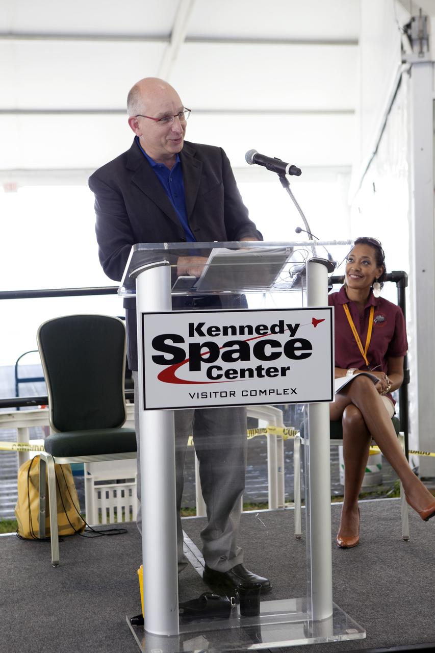 CAPE CANAVERAL, Fla. – Brian Roth, with Caterpillar, speaks to the college and university teams during the opening ceremony of NASA’s 2014 Robotics Mining Competition at the Kennedy Space Center Visitor Complex in Florida. More than 35 teams from around the U.S. have designed and built remote-controlled robots for the mining competition. The competition is a NASA Human Exploration and Operations Mission Directorate project designed to engage and retain students in science, technology, engineering and mathematics, or STEM, fields by expanding opportunities for student research and design. Teams use their remote-controlled robotics to maneuver and dig in a supersized sandbox filled with a crushed material that has characteristics similar to Martian soil. The objective of the challenge is to see which team’s robot can collect and move the most regolith within a specified amount of time. For more information, visit www.nasa.gov/nasarmc. Photo credit: NASA/Frankie Martin