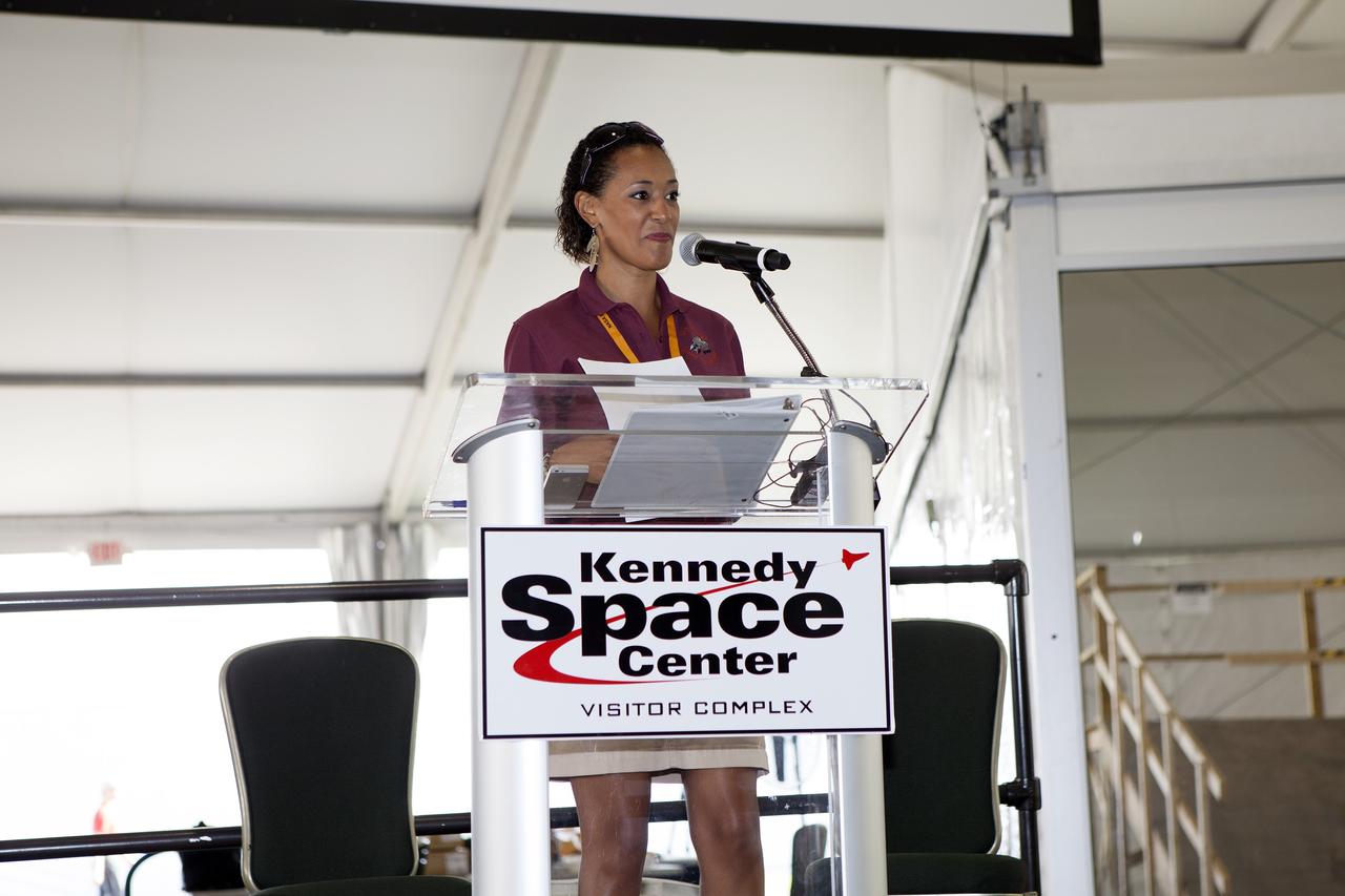 CAPE CANAVERAL, Fla. – Kimberly Land, event emcee from NASA's Ames Research Center in Moffett Field, California, speaks during the opening ceremony of NASA’s 2014 Robotics Mining Competition at the Kennedy Space Center Visitor Complex in Florida. More than 35 teams from around the U.S. have designed and built remote-controlled robots for the mining competition. The competition is a NASA Human Exploration and Operations Mission Directorate project designed to engage and retain students in science, technology, engineering and mathematics, or STEM, fields by expanding opportunities for student research and design. Teams use their remote-controlled robotics to maneuver and dig in a supersized sandbox filled with a crushed material that has characteristics similar to Martian soil. The objective of the challenge is to see which team’s robot can collect and move the most regolith within a specified amount of time. For more information, visit www.nasa.gov/nasarmc. Photo credit: NASA/Frankie Martin