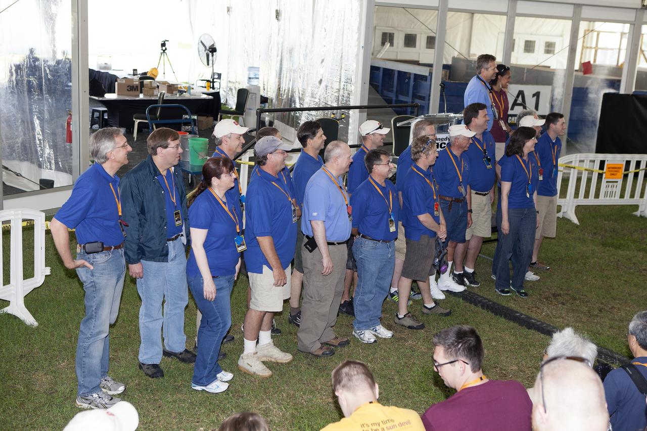 CAPE CANAVERAL, Fla. – The judges for the mining portion of NASA's 2014 Robotics Mining Competition are introduced during the opening ceremony at the Kennedy Space Center Visitor Complex in Florida. At far right, on the podium are Rob Mueller, lead technical expert and head judge from Kennedy's Engineering and Technology Directorate, and Kimberley Land, event emcee from NASA's Ames Research Center in Moffett Field, California. More than 35 teams from around the U.S. have designed and built remote-controlled robots for the mining competition. The competition is a NASA Human Exploration and Operations Mission Directorate project designed to engage and retain students in science, technology, engineering and mathematics, or STEM, fields by expanding opportunities for student research and design. Teams use their remote-controlled robotics to maneuver and dig in a supersized sandbox filled with a crushed material that has characteristics similar to Martian soil. The objective of the challenge is to see which team’s robot can collect and move the most regolith within a specified amount of time. For more information, visit www.nasa.gov/nasarmc. Photo credit: NASA/Frankie Martin