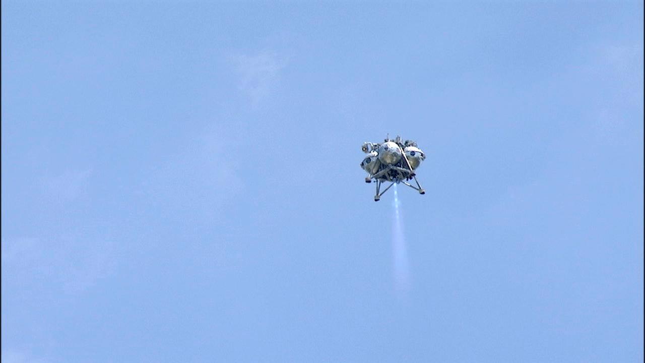 CAPE CANAVERAL, Fla. –NASA's Project Morpheus prototype lander performed a free-flight test from a launch pad at the north end of the Shuttle Landing Facility at NASA’s Kennedy Space Center in Florida. The 97-second test began at 2:30 p.m. EDT with the Morpheus lander launching from the ground over a flame trench and ascending more than 800 feet. The vehicle, with its recently installed autonomous landing and hazard avoidance technology, or ALHAT, sensors surveyed the hazard field to determine safe landing sites. Morpheus then flew forward and downward covering approximately 1,300 feet while performing a 78-foot divert to simulate a hazard avoidance maneuver. The lander descended and landed on a dedicated pad inside the ALHAT hazard field. Project Morpheus tests NASA’s ALHAT and an engine that runs on liquid oxygen and methane, which are green propellants. These new capabilities could be used in future efforts to deliver cargo to planetary surfaces.      The landing facility provides the lander with the kind of field necessary for realistic testing, complete with rocks, craters and hazards to avoid. Morpheus’ ALHAT payload allows it to navigate to clear landing sites amidst rocks, craters and other hazards during its descent. Project Morpheus is being managed under the Advanced Exploration Systems, or AES, Division in NASA’s Human Exploration and Operations Mission Directorate. The efforts in AES pioneer new approaches for rapidly developing prototype systems, demonstrating key capabilities and validating operational concepts for future human missions beyond Earth orbit. For more information on Project Morpheus, visit http://morpheuslander.jsc.nasa.gov/. Photo credit: NASA/Mike Chambers and Chris Chamberland