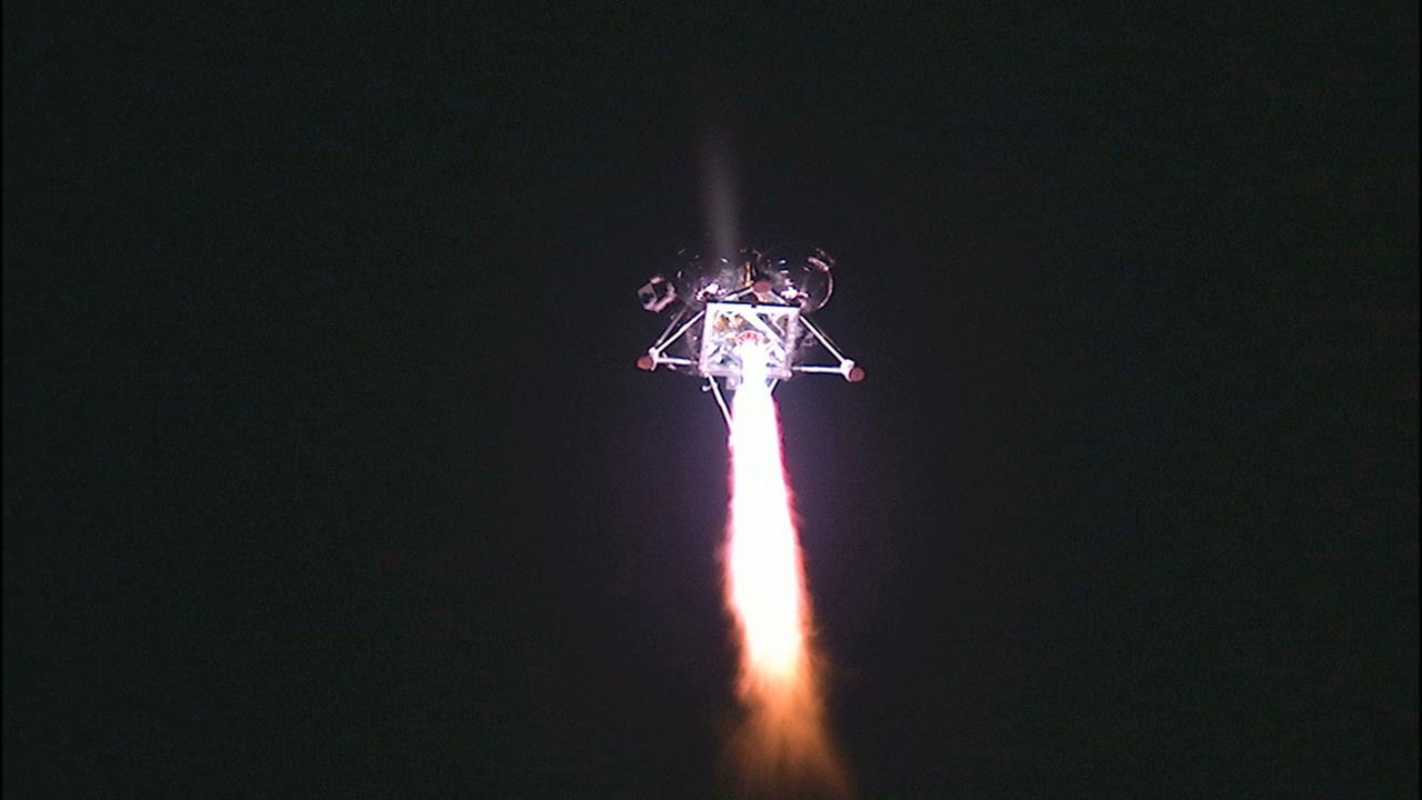 CAPE CANAVERAL, Fla. -- The first free-flight test of NASA's Morpheus prototype lander was conducted at the Shuttle Landing Facility at NASA's Kennedy Space Center in Florida. The 98-second test began at 10:02 p.m. EDT with the Morpheus lander launching from the ground over a flame trench and ascending more than 800 feet. The vehicle, with its autonomous landing and hazard avoidance technology, or ALHAT sensors, surveyed the hazard field to determine safe landing sites. Morpheus then flew forward and downward covering approximately 1,300 feet while performing a 78-foot divert to simulate a hazard avoidance maneuver. The lander then descended and landed on a dedicated pad inside the test field. Project Morpheus tests NASA’s ALHAT and an engine that runs on liquid oxygen and methane, which are green propellants. These new capabilities could be used in future efforts to deliver cargo to planetary surfaces.    The landing facility provides the lander with the kind of field necessary for realistic testing, complete with rocks, craters and hazards to avoid. Morpheus’ ALHAT payload allows it to navigate to clear landing sites amidst rocks, craters and other hazards during its descent. Project Morpheus is being managed under the Advanced Exploration Systems, or AES, Division in NASA’s Human Exploration and Operations Mission Directorate. The efforts in AES pioneer new approaches for rapidly developing prototype systems, demonstrating key capabilities and validating operational concepts for future human missions beyond Earth orbit. For more information on Project Morpheus, visit http://morpheuslander.jsc.nasa.gov/.  Photo credit: NASA/Mike Chambers