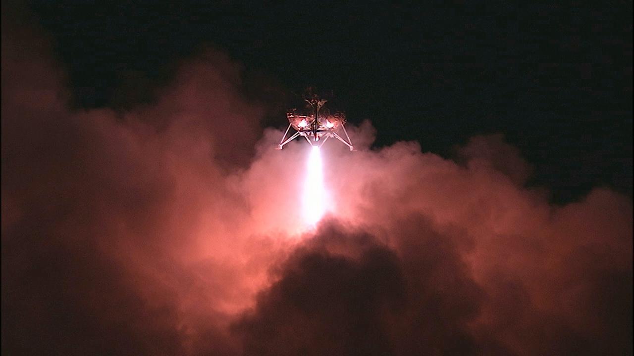 CAPE CANAVERAL, Fla. -- The first free-flight test of NASA's Morpheus prototype lander was conducted at the Shuttle Landing Facility at NASA's Kennedy Space Center in Florida. The 98-second test began at 10:02 p.m. EDT with the Morpheus lander launching from the ground over a flame trench and ascending more than 800 feet. The vehicle, with its autonomous landing and hazard avoidance technology, or ALHAT sensors, surveyed the hazard field to determine safe landing sites. Morpheus then flew forward and downward covering approximately 1,300 feet while performing a 78-foot divert to simulate a hazard avoidance maneuver. The lander then descended and landed on a dedicated pad inside the test field. Project Morpheus tests NASA’s ALHAT and an engine that runs on liquid oxygen and methane, which are green propellants. These new capabilities could be used in future efforts to deliver cargo to planetary surfaces. The landing facility provides the lander with the kind of field necessary for realistic testing, complete with rocks, craters and hazards to avoid. Morpheus’ ALHAT payload allows it to navigate to clear landing sites amidst rocks, craters and other hazards during its descent. Project Morpheus is being managed under the Advanced Exploration Systems, or AES, Division in NASA’s Human Exploration and Operations Mission Directorate. The efforts in AES pioneer new approaches for rapidly developing prototype systems, demonstrating key capabilities and validating operational concepts for future human missions beyond Earth orbit. For more information on Project Morpheus, visit http://morpheuslander.jsc.nasa.gov/. Photo credit: NASA/Mike Chambers