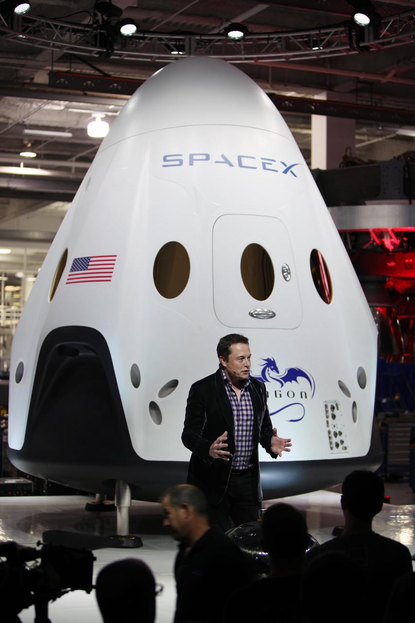 HAWTHORNE, Calif. - HAWTHORNE, Calif. - SpaceX CEO and founder Elon Musk unveils the Dragon V2 during a ceremony for the new spacecraft inside SpaceX headquarters in Hawthorne, Calif. The spacecraft is designed to carry people into Earth's orbit and was developed in partnership with NASA's Commercial Crew Program under the Commercial Crew Integrated Capability agreement. SpaceX is one of NASA's commercial partners working to develop a new generation of U.S. spacecraft and rockets capable of transporting humans to and from Earth's orbit from American soil. Ultimately, NASA intends to use such commercial systems to fly U.S. astronauts to and from the International Space Station. Photo credit: NASA/Dimitri Gerondidakis
