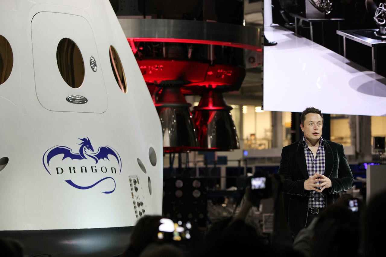 HAWTHORNE, Calif. - SpaceX CEO and founder Elon Musk discusses the Dragon V2 during an unveiling ceremony for the new spacecraft inside SpaceX headquarters in Hawthorne, Calif. The spacecraft is designed to carry people into Earth's orbit and was developed in partnership with NASA's Commercial Crew Program under the Commercial Crew Integrated Capability agreement. SpaceX is one of NASA's commercial partners working to develop a new generation of U.S. spacecraft and rockets capable of transporting humans to and from Earth's orbit from American soil. Ultimately, NASA intends to use such commercial systems to fly U.S. astronauts to and from the International Space Station. Photo credit: NASA/Dimitri Gerondidakis