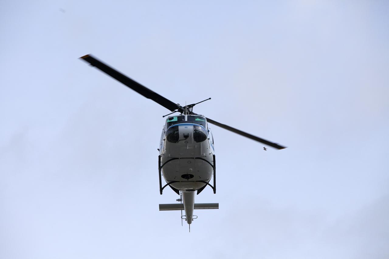 -- CAPE CANAVERAL, Fla. -- At NASA's Kennedy Space Center in Florida, an agency helicopter flies in to land during a training exercise. The activity taking place in Kennedy's Launch Complex 39 turn-basin parking lot was only one of several drills. It was part of a new training program that was developed by Kennedy's Fire Rescue department along with NASA Aircraft Operations to sharpen the skills needed to help rescue personnel learn how to collaborate with helicopter pilots in taking injured patients to hospitals as quickly as possible. Photo credit: NASA/Dan Casper