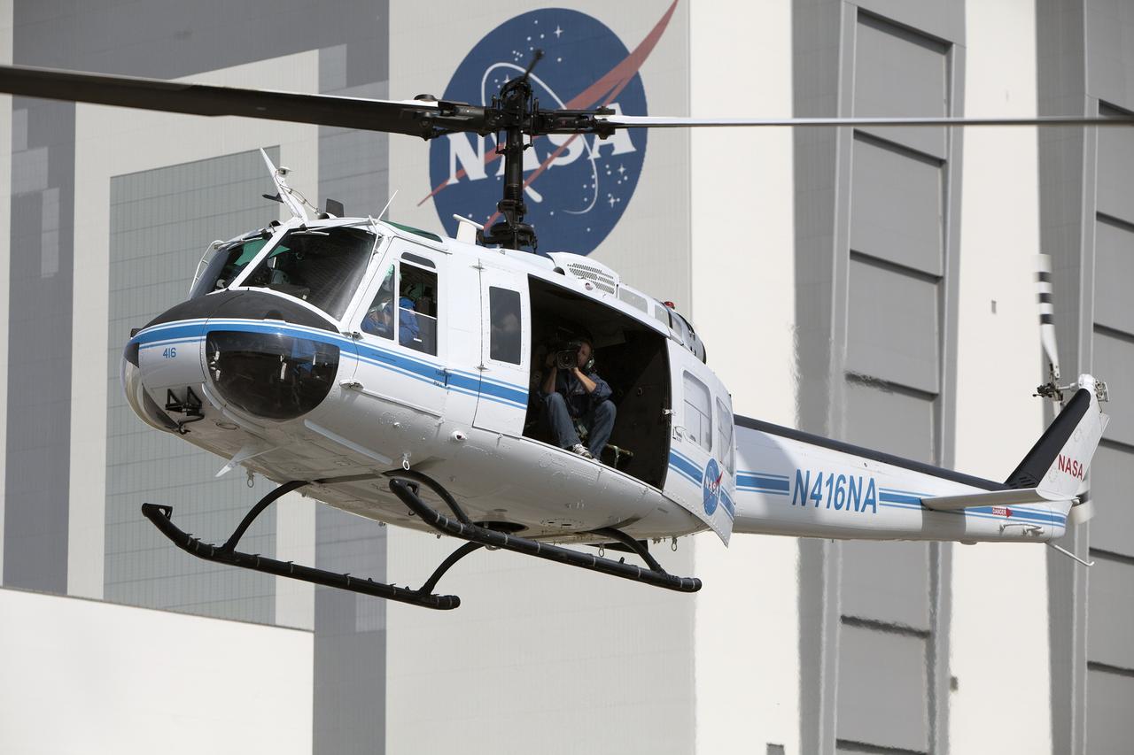 CAPE CANAVERAL, Fla. -- At NASA's Kennedy Space Center in Florida, an agency helicopter flies over the Vehicle Assembly Building prior to landing for a training exercise.    The activity taking place in Kennedy's Launch Complex 39 turn-basin parking lot was only one of several drills. It was part of a new training program that was developed by Kennedy's Fire Rescue department along with NASA Aircraft Operations to sharpen the skills needed to help rescue personnel learn how to collaborate with helicopter pilots in taking injured patients to hospitals as quickly as possible. Photo credit: NASA/Dan Casper