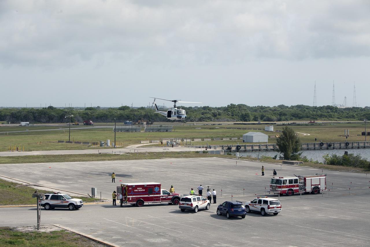 CAPE CANAVERAL, Fla. -- At NASA's Kennedy Space Center in Florida, agency helicopter takes off during a training exercise. The activity taking place in Kennedy's Launch Complex 39 turn-basin parking lot was only one of several drills. It was part of a new training program that was developed by Kennedy's Fire Rescue department along with NASA Aircraft Operations to sharpen the skills needed to help rescue personnel learn how to collaborate with helicopter pilots in taking injured patients to hospitals as quickly as possible. Photo credit: NASA/Dan Casper