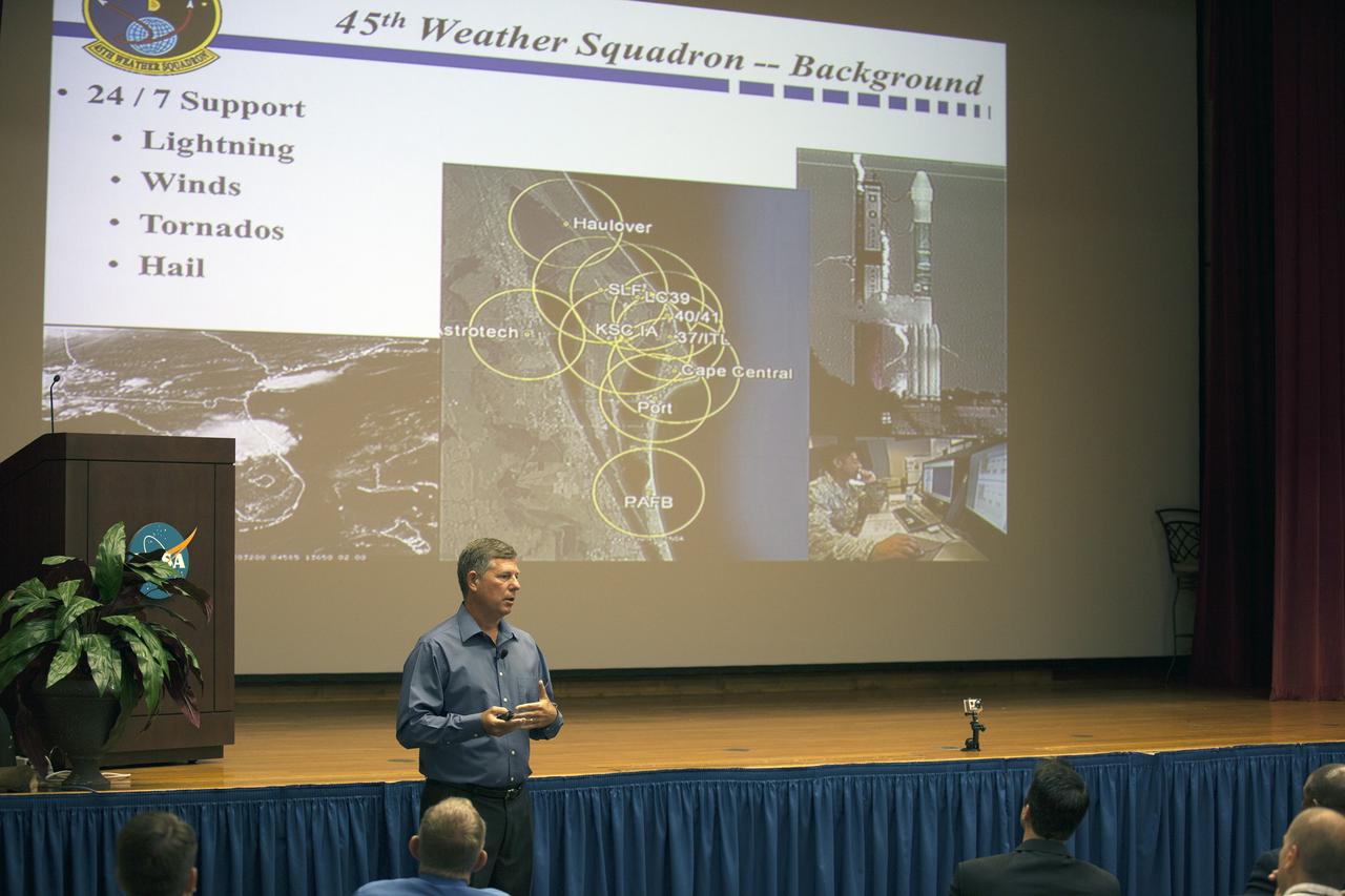 CAPE CANAVERAL, Fla. -- Todd McNamara, meteorologist with the 45th Weather Squadron at Patrick Air Force Base in Florida, addresses the audience of the annual hurricane awareness briefing at NASA's Kennedy Space Center in Florida.    The briefing, held at the start of the 2014 hurricane season, is attended by the center's emergency hurricane coordinators and other interested employees in the KSC Training Auditorium. The briefing also is broadcast to the workforce.  For more information, visit http://www.patrick.af.mil/weather.  Photo credit: NASA/Kim Shiflett