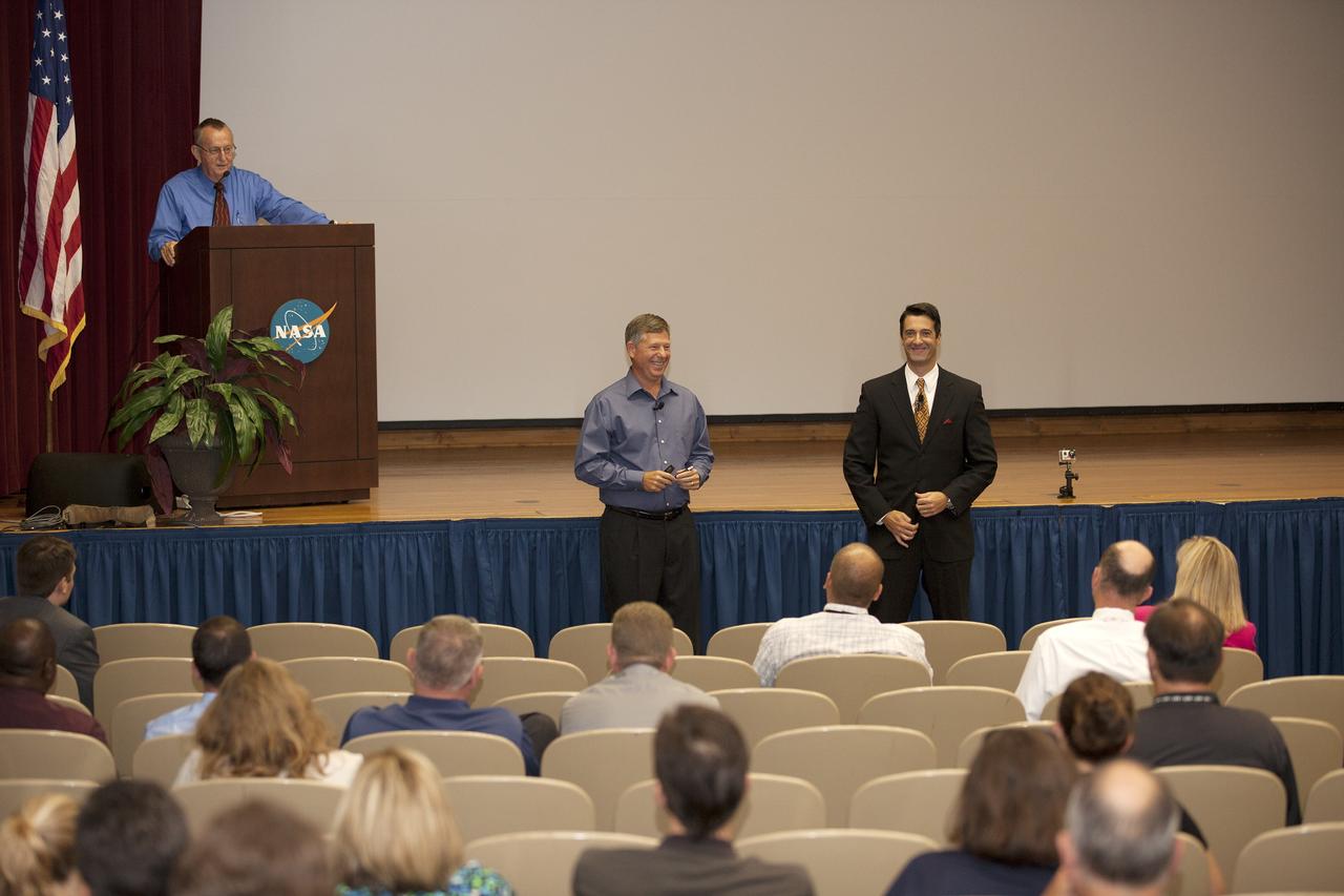 CAPE CANAVERAL, Fla. -- Todd McNamara, center, meteorologist with the 45th Weather Squadron at Patrick Air Force Base, and Tony Mainolfi, right, chief meteorologist of WESH 2 news, take questions from the audience of the annual hurricane awareness briefing at NASA's Kennedy Space Center in Florida. At the podium is moderator Wayne Kee, NASA emergency manager for the center.    The briefing, held at the start of the 2014 hurricane season, is attended by the center's emergency hurricane coordinators and other interested employees in the KSC Training Auditorium. The briefing also is broadcast to the workforce.  For more information, visit http://www.patrick.af.mil/weather.  Photo credit: NASA/Kim Shiflett