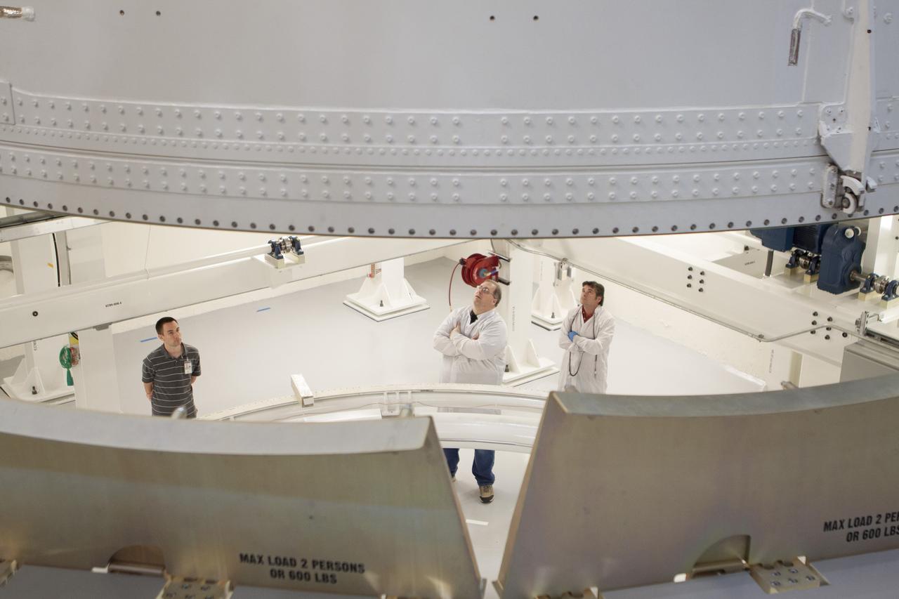 CAPE CANAVERAL, Fla. -- Inside the Operations and Checkout Building high bay at NASA's Kennedy Space Center in Florida, NASA and Lockheed Martin engineers and technicians monitor the progress as a crane lowers the Orion service module into the Final Assembly and System Testing, or FAST, cell. The Orion crew module will be stacked on the service module in the FAST cell and then both modules will be put through their final system tests for Exploration Flight Test-1, or EFT-1, before rolling out of the facility for integration with the United Launch Alliance Delta IV Heavy rocket.     Orion is the exploration spacecraft designed to carry astronauts to destinations not yet explored by humans, including an asteroid and Mars. It will have emergency abort capability, sustain the crew during space travel and provide safe re-entry from deep space return velocities. The first unpiloted test flight of Orion, EFT-1, is scheduled to launch later this year atop a Delta IV rocket from Cape Canaveral Air Force Station in Florida to an altitude of 3,600 miles above the Earth's surface. The two-orbit, four-hour flight test will help engineers evaluate the systems critical to crew safety including the heat shield, parachute system and launch abort system. For more information, visit http://www.nasa.gov/orion. Photo credit: NASA/Glenn Benson