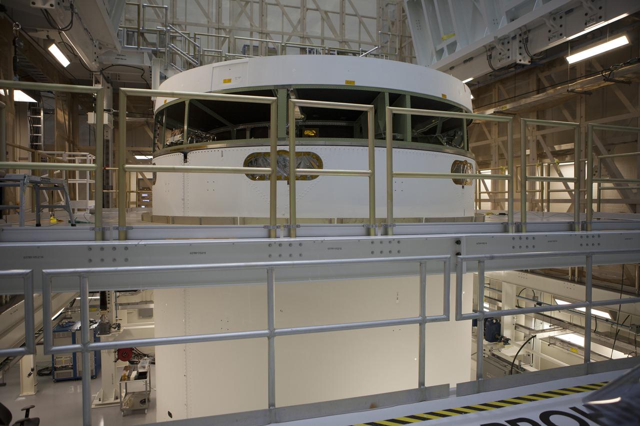 CAPE CANAVERAL, Fla. -- Inside the Operations and Checkout Building high bay at NASA's Kennedy Space Center in Florida, the Orion service module has been secured in the Final Assembly and System Testing, or FAST, cell. The Orion crew module will be stacked on the service module in the FAST cell and then both modules will be put through their final system tests for Exploration Flight Test-1, or EFT-1, before rolling out of the facility for integration with the United Launch Alliance Delta IV Heavy rocket.      Orion is the exploration spacecraft designed to carry astronauts to destinations not yet explored by humans, including an asteroid and Mars. It will have emergency abort capability, sustain the crew during space travel and provide safe re-entry from deep space return velocities. The first unpiloted test flight of Orion, EFT-1, is scheduled to launch later this year atop a Delta IV rocket from Cape Canaveral Air Force Station in Florida to an altitude of 3,600 miles above the Earth's surface. The two-orbit, four-hour flight test will help engineers evaluate the systems critical to crew safety including the heat shield, parachute system and launch abort system. For more information, visit http://www.nasa.gov/orion. Photo credit: NASA/Glenn Benson