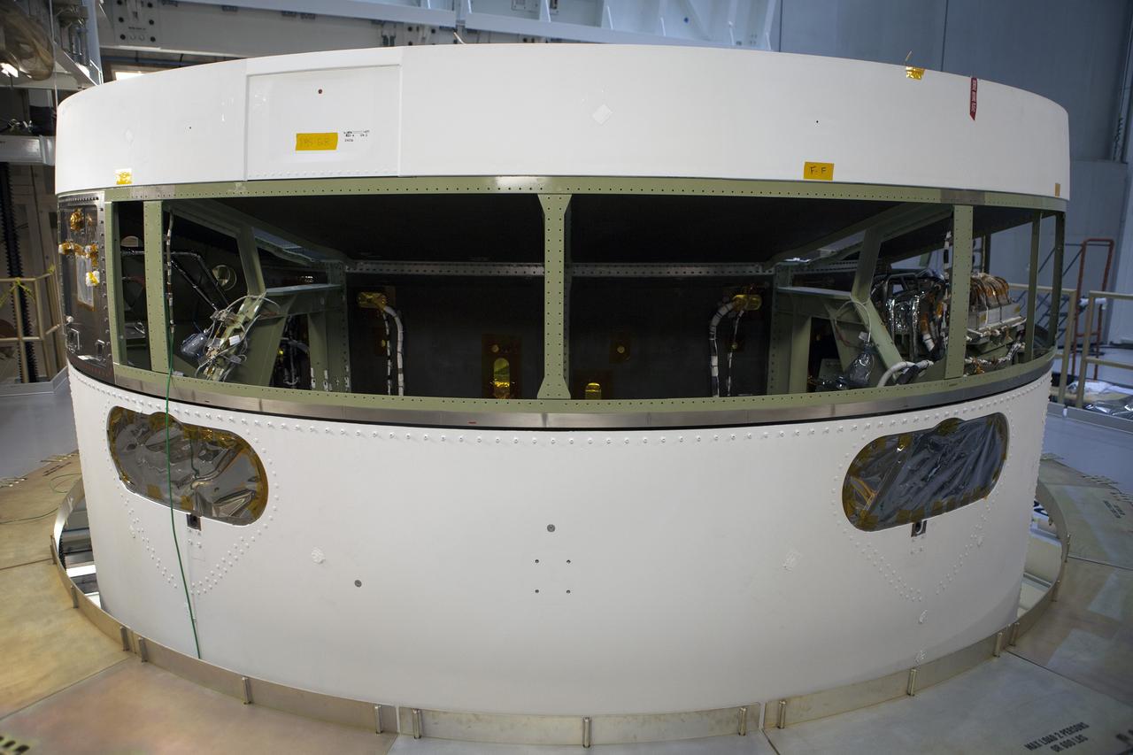 CAPE CANAVERAL, Fla. -- Inside the Operations and Checkout Building high bay at NASA's Kennedy Space Center in Florida, the Orion service module has been secured in the Final Assembly and System Testing, or FAST, cell. The Orion crew module will be stacked on the service module in the FAST cell and then both modules will be put through their final system tests for Exploration Flight Test-1, or EFT-1, before rolling out of the facility for integration with the United Launch Alliance Delta IV Heavy rocket.      Orion is the exploration spacecraft designed to carry astronauts to destinations not yet explored by humans, including an asteroid and Mars. It will have emergency abort capability, sustain the crew during space travel and provide safe re-entry from deep space return velocities. The first unpiloted test flight of Orion, EFT-1, is scheduled to launch later this year atop a Delta IV rocket from Cape Canaveral Air Force Station in Florida to an altitude of 3,600 miles above the Earth's surface. The two-orbit, four-hour flight test will help engineers evaluate the systems critical to crew safety including the heat shield, parachute system and launch abort system. For more information, visit http://www.nasa.gov/orion. Photo credit: NASA/Glenn Benson