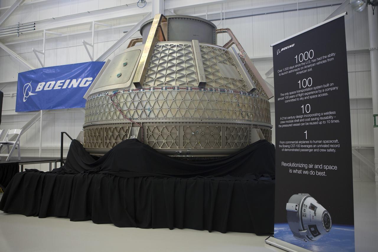 CAPE CANAVERAL, Fla. – The pressure vessel of The Boeing Company's CST-100 was displayed by the company during a ceremony inside Orbiter Processing Facility 3 at NASA's Kennedy Space Center in Florida. The pressure vessel is the shell of the finished spacecraft and encases the crew compartment and supplies on the inside. A heat shield and many other components are attached to the exterior to complete the spacecraft. Photo credit: NASA/Kim Shiflett