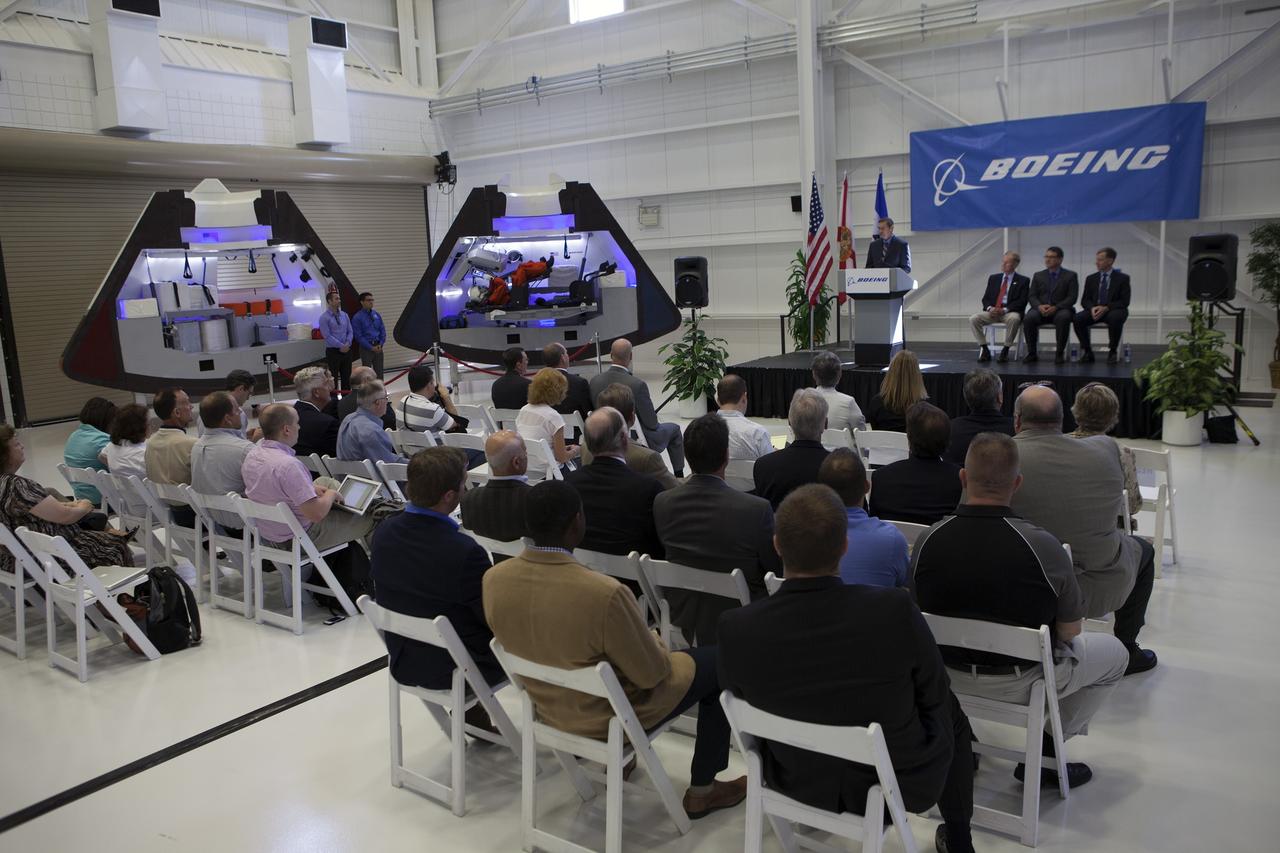 CAPE CANAVERAL, Fla. – John Elbon, The Boeing Company's vice president general manager of Boeing Space Systems, discusses the CST-100 spacecraft during a ceremony inside Orbiter Processing Facility 3 at NASA's Kennedy Space Center in Florida. Photo credit: NASA/Kim Shiflett