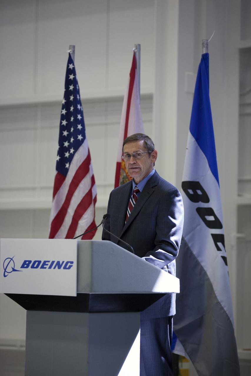 CAPE CANAVERAL, Fla. – John Elbon, The Boeing Company's vice president general manager of Boeing Space Systems, discusses the CST-100 spacecraft during a ceremony inside Orbiter Processing Facility 3 at NASA's Kennedy Space Center in Florida. Photo credit: NASA/Kim Shiflett