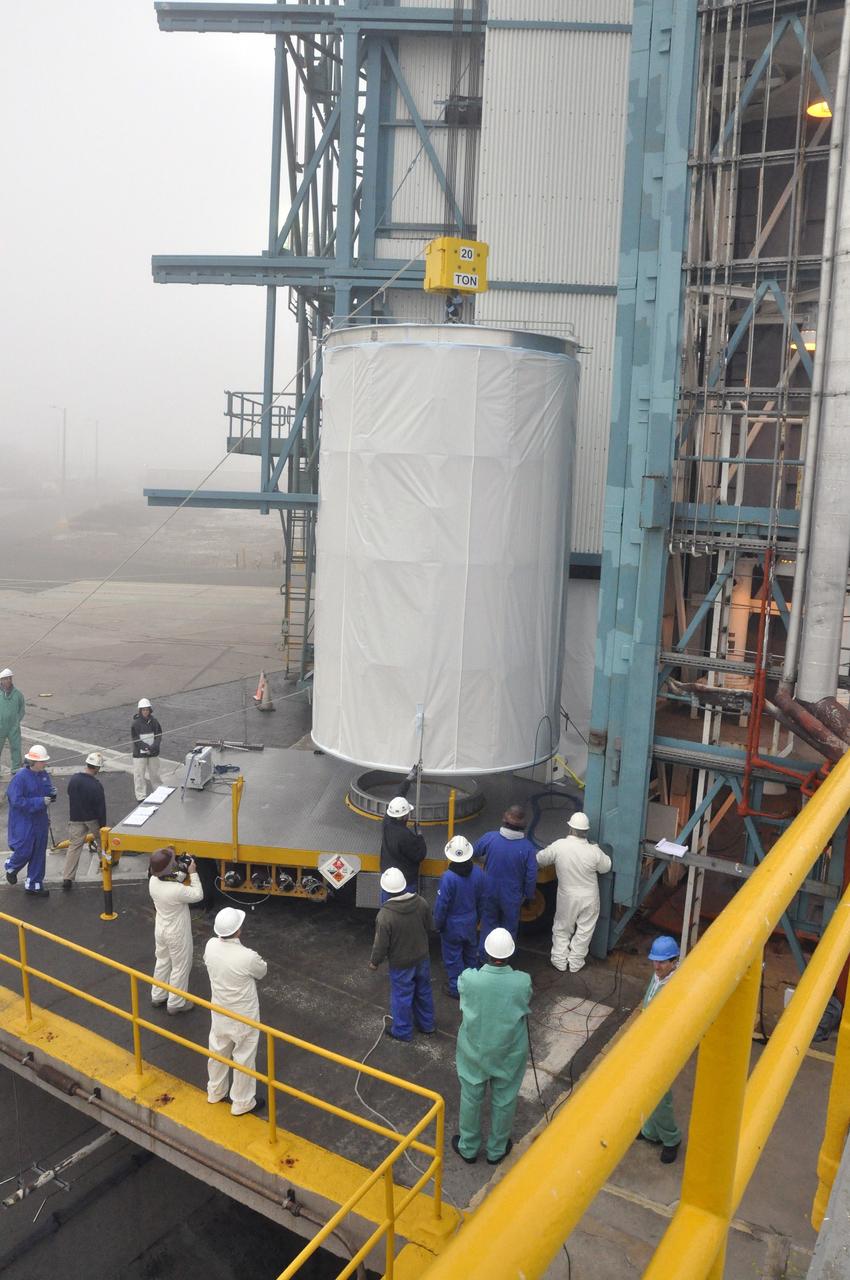 VANDENBERG AIR FORCE BASE, Calif. – A 20-ton crane lifts NASA's Orbiting Carbon Observatory-2, or OCO-2, from its transporter beside the mobile service tower at Space Launch Complex 2 at Vandenberg Air Force Base in California. The spacecraft will be mated with the United Launch Alliance Delta II rocket inside the tower. Launch is scheduled for July 1. OCO-2 will collect precise global measurements of carbon dioxide in the Earth's atmosphere and provide scientists with a better idea of the chemical compound's impacts on climate change. Scientists will analyze this data to improve our understanding of the natural processes and human activities that regulate the abundance and distribution of this important atmospheric gas. To learn more about OCO-2, visit http://oco.jpl.nasa.gov. Photo credit: NASA/Randy Beaudoin