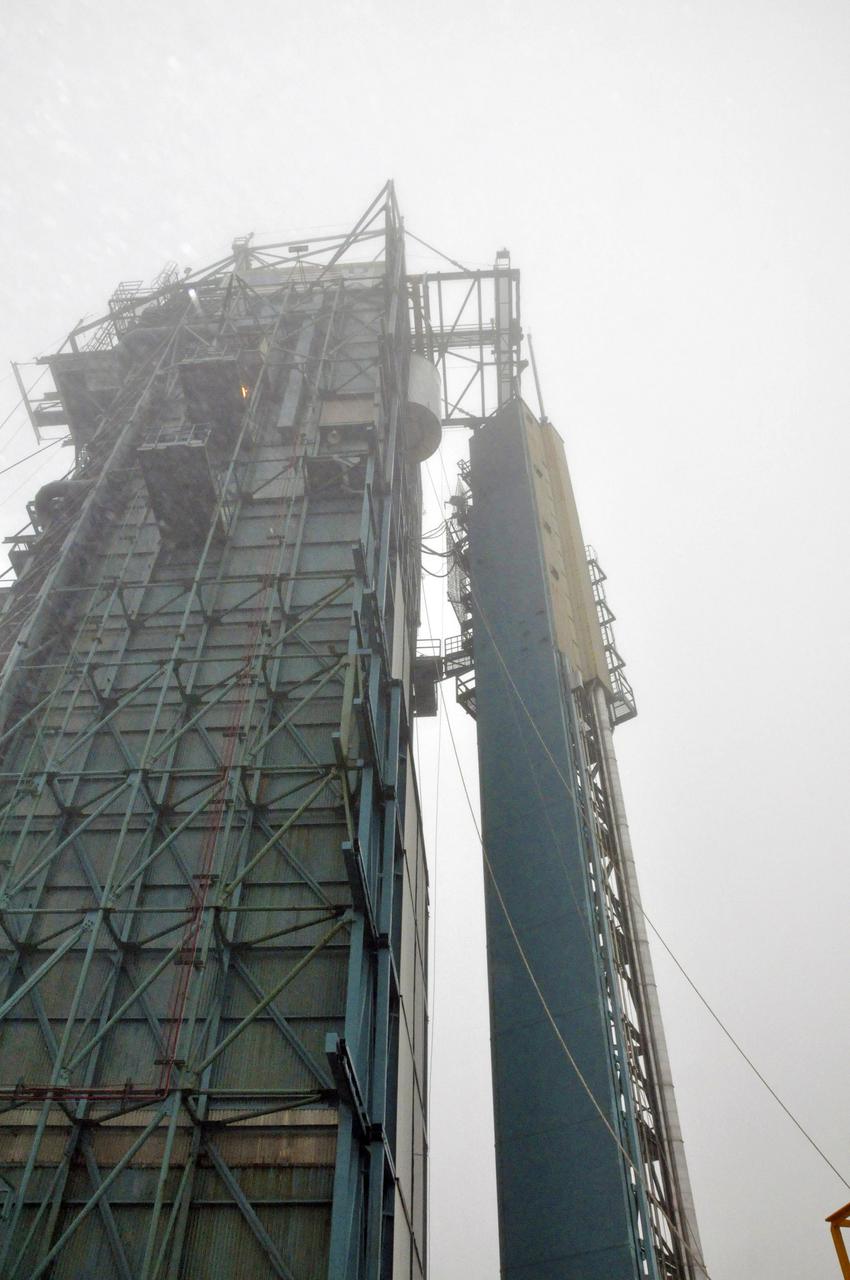 VANDENBERG AIR FORCE BASE, Calif. – NASA's Orbiting Carbon Observatory-2, or OCO-2, is transferred into the clean room at the top of the mobile service tower at Space Launch Complex 2 at Vandenberg Air Force Base in California. There it will be encapsulated into the Delta II payload fairing and mated with the United Launch Alliance Delta II rocket inside the tower. Launch is scheduled for July 1.  OCO-2 will collect precise global measurements of carbon dioxide in the Earth's atmosphere and provide scientists with a better idea of the chemical compound's impacts on climate change. Scientists will analyze this data to improve our understanding of the natural processes and human activities that regulate the abundance and distribution of this important atmospheric gas. To learn more about OCO-2, visit http://oco.jpl.nasa.gov.  Photo credit: NASA/Randy Beaudoin
