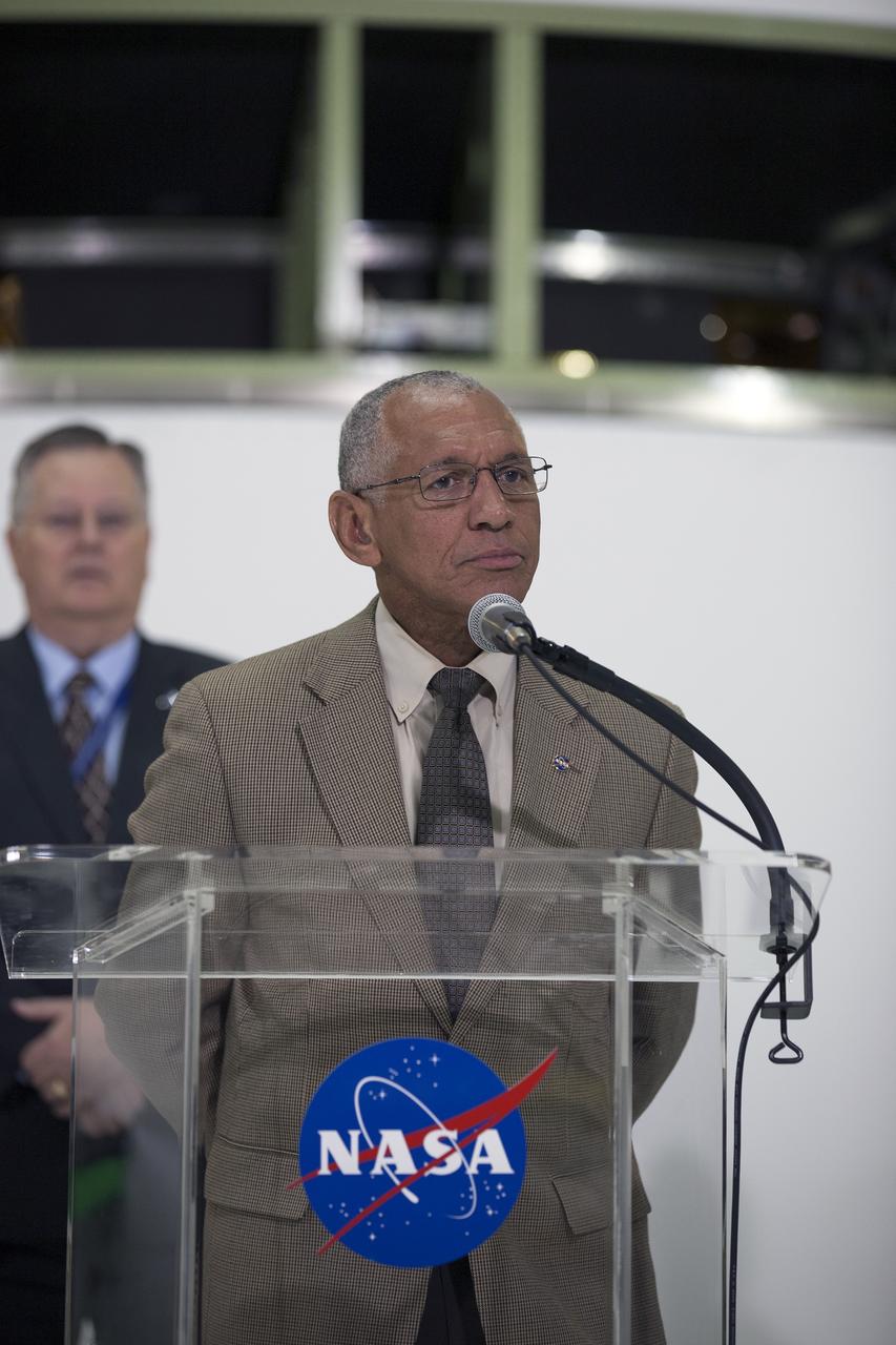 CAPE CANAVERAL, Fla. – NASA Administrator Charlie Bolden helps mark the T-6 months and counting to the launch of Orion on Exploration Flight Test-1, or EFT-1, during a visit to the Operations and Checkout Building high bay at NASA's Kennedy Space Center in Florida. The crew module has been stacked on the service module in the Final Assembly and System Testing cell. EFT-1 will provide engineers with data about the heat shield's ability to protect Orion and its future crews from the 4,000-degree heat of reentry and an ocean splashdown following the spacecraft’s 20,000-mph reentry from space. Data gathered during the flight will inform decisions about design improvements on the heat shield and other Orion systems, and authenticate existing computer models and new approaches to space systems design and development. This process is critical to reducing overall risks and costs of future Orion missions.    Orion is the exploration spacecraft designed to carry astronauts to destinations not yet explored by humans, including an asteroid and Mars. It will have emergency abort capability, sustain the crew during space travel and provide safe re-entry from deep space return velocities. The first unpiloted test flight of the Orion is scheduled to launch later this year atop a Delta IV rocket from Cape Canaveral Air Force Station in Florida to an altitude of 3,600 miles above the Earth's surface. The two-orbit, four-hour flight test will help engineers evaluate the systems critical to crew safety including the heat shield, parachute system and launch abort system. For more information, visit http://www.nasa.gov/orion. Photo credit: NASA/Kim Shiflett