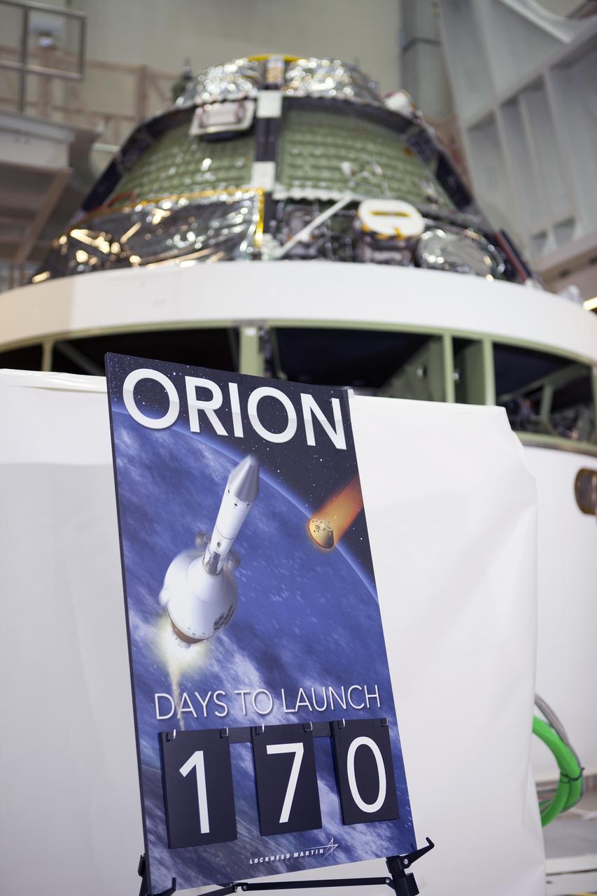 CAPE CANAVERAL, Fla. – Inside the Operations and Checkout Building high bay at NASA's Kennedy Space Center in Florida, the Orion crew module has been stacked on the service module in the Final Assembly and System Testing cell. NASA Administrator Charlie Bolden spoke to the media during an event to mark the T-6 months and counting to the launch of Orion on Exploration Flight Test-1, or EFT-1. The flight test will provide engineers with data about the heat shield's ability to protect Orion and its future crews from the 4,000-degree heat of reentry and an ocean splashdown following the spacecraft’s 20,000-mph reentry from space. Data gathered during the flight will inform decisions about design improvements on the heat shield and other Orion systems, and authenticate existing computer models and new approaches to space systems design and development. This process is critical to reducing overall risks and costs of future Orion missions. Orion is the exploration spacecraft designed to carry astronauts to destinations not yet explored by humans, including an asteroid and Mars. It will have emergency abort capability, sustain the crew during space travel and provide safe re-entry from deep space return velocities. The first unpiloted test flight of the Orion is scheduled to launch later this year atop a Delta IV rocket from Cape Canaveral Air Force Station in Florida to an altitude of 3,600 miles above the Earth's surface. The two-orbit, four-hour flight test will help engineers evaluate the systems critical to crew safety including the heat shield, parachute system and launch abort system. For more information, visit http://www.nasa.gov/orion. Photo credit: NASA/Kim Shiflett