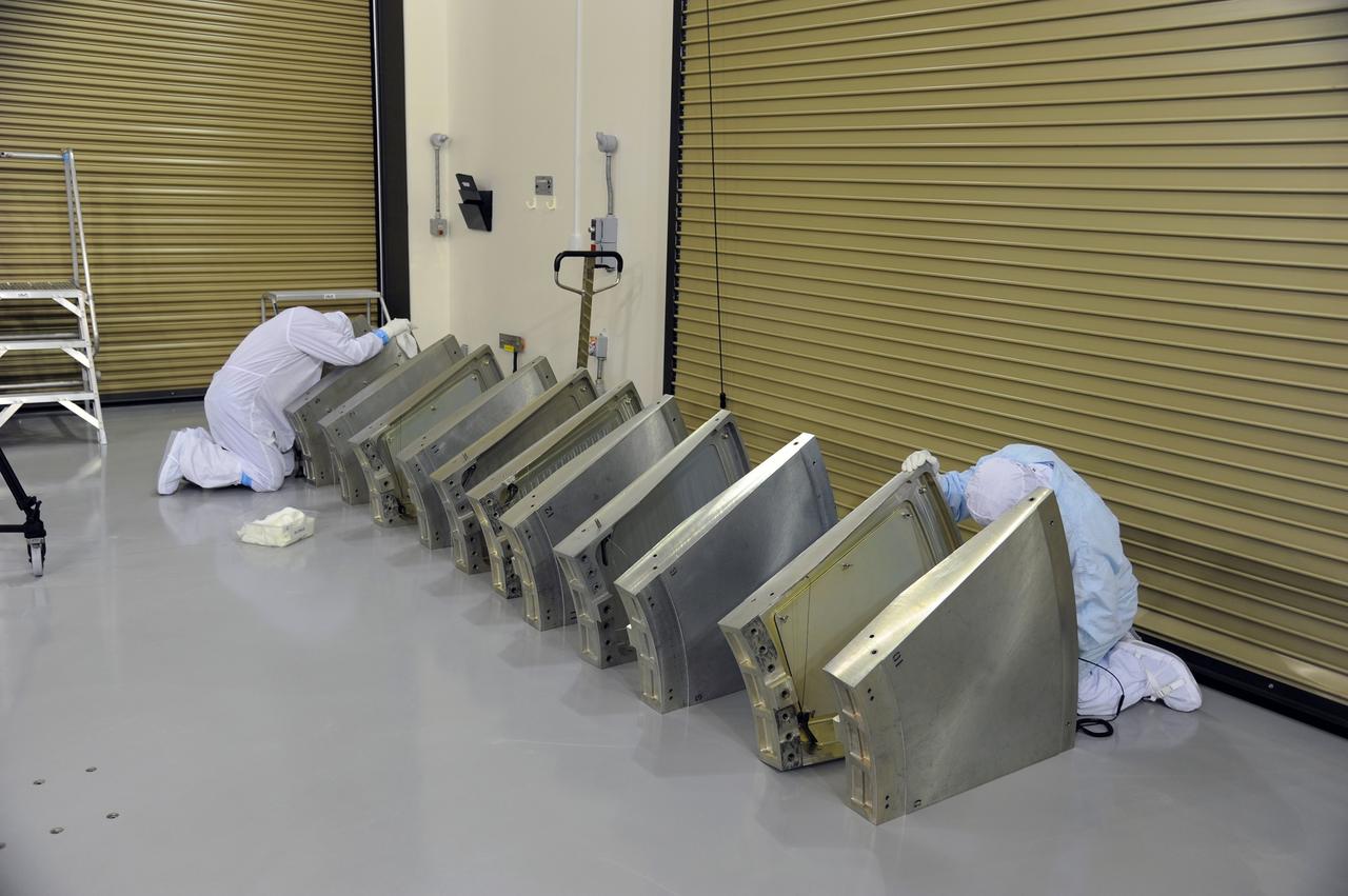 VANDENBERG AIR FORCE BASE, Calif. – Technicians clean some of the hardware for NASA's Orbiting Carbon Observatory-2 mission, or OCO-2, in the Astrotech Payload Processing Facility on Vandenberg Air Force Base in California. The spacecraft soon will be transported to Space Launch Complex 2 for encapsulation in the Delta II payload fairing.    Launch aboard a United Launch Alliance Delta II rocket is scheduled for 5:56 a.m. EDT on July 1.  OCO-2 is NASA’s first mission dedicated to studying atmospheric carbon dioxide, the leading human-produced greenhouse gas driving changes in Earth’s climate. OCO-2 will provide a new tool for understanding the human and natural sources of carbon dioxide emissions and the natural "sinks" that absorb carbon dioxide and help control its buildup. The observatory will measure the global geographic distribution of these sources and sinks and study their changes over time. To learn more about OCO-2, visit http://oco.jpl.nasa.gov.  Photo credit: NASA/30th Space Wing, U.S. Air Force
