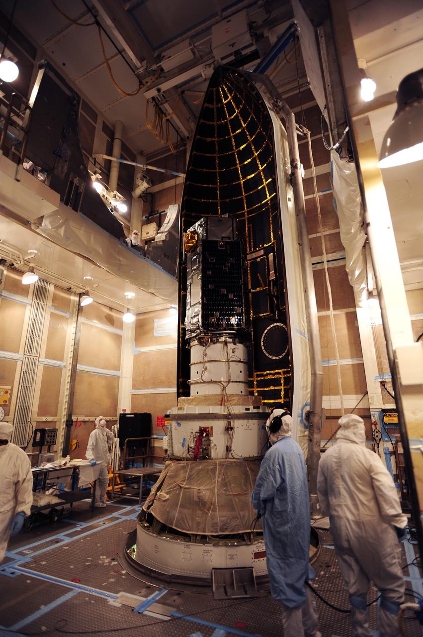 VANDENBERG AIR FORCE BASE, Calif. – Technicians monitor a half-section of the Delta II payload fairing as it is moved toward NASA's Orbiting Carbon Observatory-2, or OCO-2, in the mobile service tower at Space Launch Complex 2 on Vandenberg Air Force Base in California.    The fairing will protect OCO-2 during launch aboard a United Launch Alliance Delta II rocket, scheduled for 5:56 a.m. EDT on July 1.  OCO-2 is NASA’s first mission dedicated to studying atmospheric carbon dioxide, the leading human-produced greenhouse gas driving changes in Earth’s climate. OCO-2 will provide a new tool for understanding the human and natural sources of carbon dioxide emissions and the natural "sinks" that absorb carbon dioxide and help control its buildup. The observatory will measure the global geographic distribution of these sources and sinks and study their changes over time. To learn more about OCO-2, visit http://oco.jpl.nasa.gov.  Photo credit: NASA/30th Space Wing, U.S. Air Force