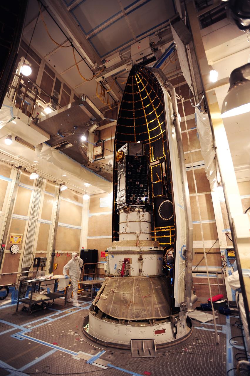 VANDENBERG AIR FORCE BASE, Calif. – Half of the Delta II payload fairing for NASA's Orbiting Carbon Observatory-2, or OCO-2, is positioned around the spacecraft in the mobile service tower at Space Launch Complex 2 on Vandenberg Air Force Base in California.    The fairing will protect OCO-2 during launch aboard a United Launch Alliance Delta II rocket, scheduled for 5:56 a.m. EDT on July 1.  OCO-2 is NASA’s first mission dedicated to studying atmospheric carbon dioxide, the leading human-produced greenhouse gas driving changes in Earth’s climate. OCO-2 will provide a new tool for understanding the human and natural sources of carbon dioxide emissions and the natural "sinks" that absorb carbon dioxide and help control its buildup. The observatory will measure the global geographic distribution of these sources and sinks and study their changes over time. To learn more about OCO-2, visit http://oco.jpl.nasa.gov.  Photo credit: NASA/30th Space Wing, U.S. Air Force