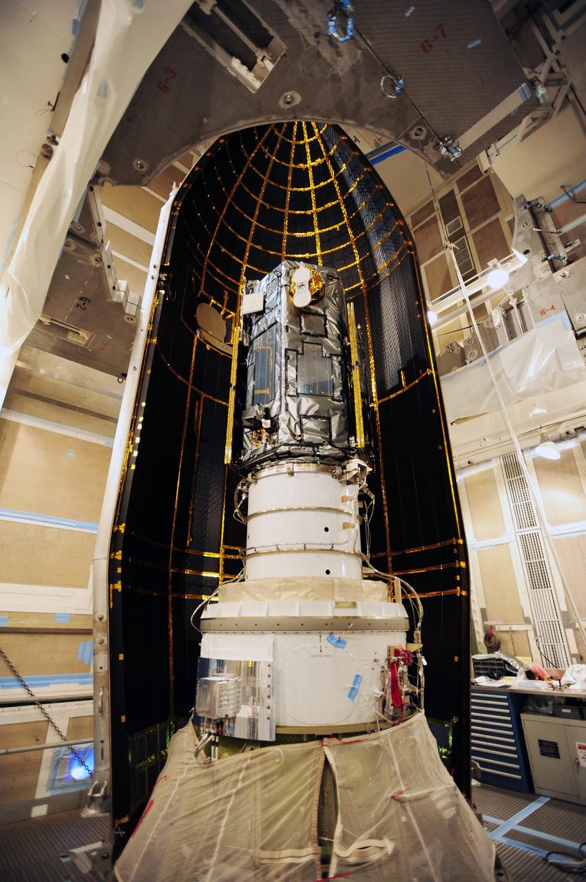 VANDENBERG AIR FORCE BASE, Calif. – Half of the Delta II payload fairing for NASA's Orbiting Carbon Observatory-2, or OCO-2, is secured around the spacecraft in the mobile service tower at Space Launch Complex 2 on Vandenberg Air Force Base in California.    The fairing will protect OCO-2 during launch aboard a United Launch Alliance Delta II rocket, scheduled for 5:56 a.m. EDT on July 1.  OCO-2 is NASA’s first mission dedicated to studying atmospheric carbon dioxide, the leading human-produced greenhouse gas driving changes in Earth’s climate. OCO-2 will provide a new tool for understanding the human and natural sources of carbon dioxide emissions and the natural "sinks" that absorb carbon dioxide and help control its buildup. The observatory will measure the global geographic distribution of these sources and sinks and study their changes over time. To learn more about OCO-2, visit http://oco.jpl.nasa.gov.  Photo credit: NASA/30th Space Wing, U.S. Air Force