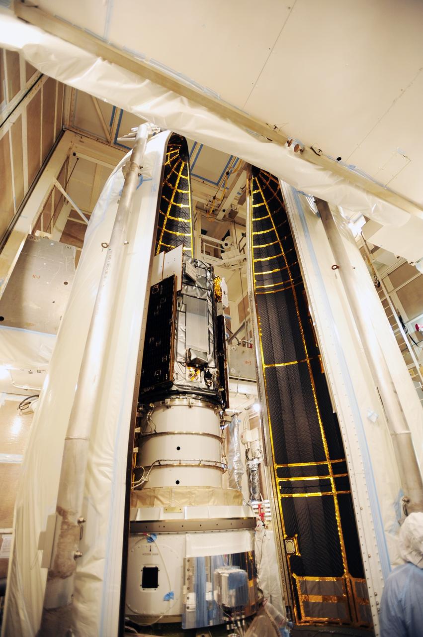 VANDENBERG AIR FORCE BASE, Calif. – The half-sections of the Delta II payload fairing roll into position to surround NASA's Orbiting Carbon Observatory-2, or OCO-2, in the mobile service tower at Space Launch Complex 2 on Vandenberg Air Force Base in California.    The fairing will protect OCO-2 during launch aboard a United Launch Alliance Delta II rocket, scheduled for 5:56 a.m. EDT on July 1.  OCO-2 is NASA’s first mission dedicated to studying atmospheric carbon dioxide, the leading human-produced greenhouse gas driving changes in Earth’s climate. OCO-2 will provide a new tool for understanding the human and natural sources of carbon dioxide emissions and the natural "sinks" that absorb carbon dioxide and help control its buildup. The observatory will measure the global geographic distribution of these sources and sinks and study their changes over time. To learn more about OCO-2, visit http://oco.jpl.nasa.gov.  Photo credit: NASA/30th Space Wing, U.S. Air Force